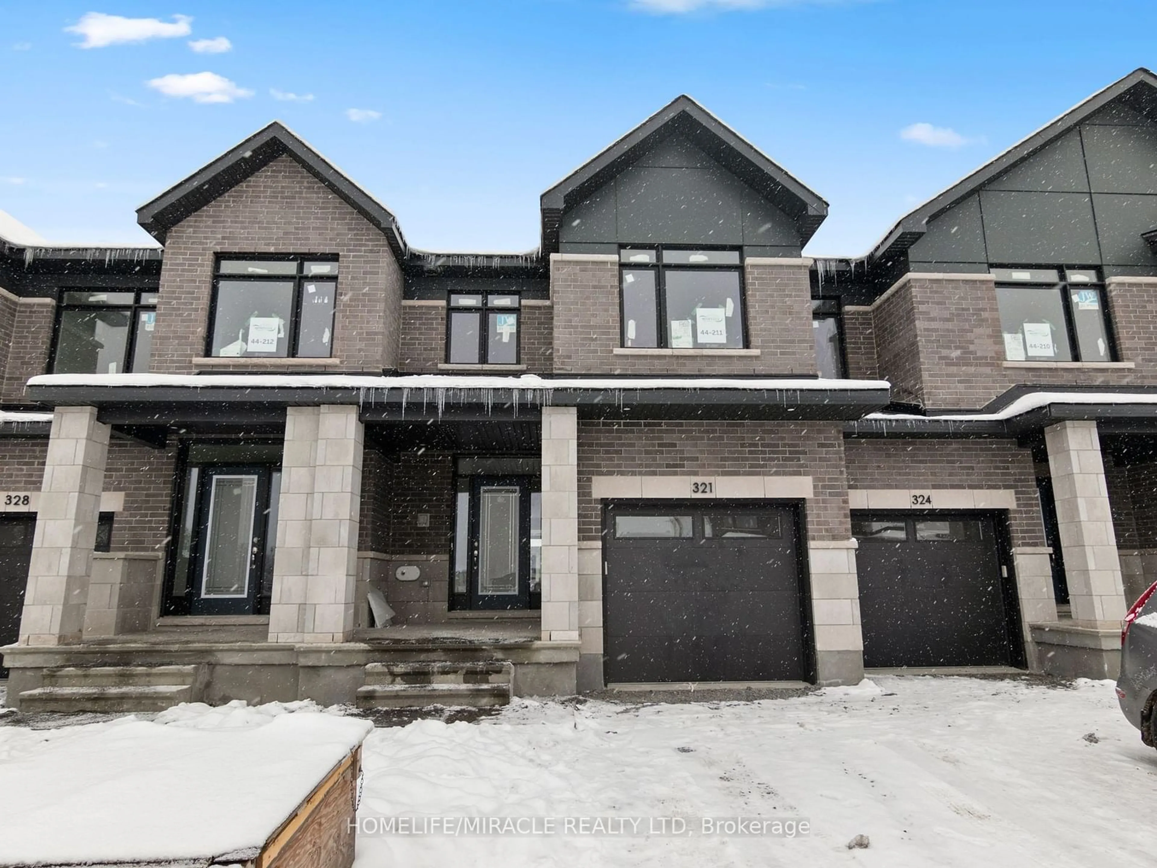 Home with brick exterior material, street for 321 Makobe Lane, Blossom Park - Airport and Area Ontario K4M 0M1