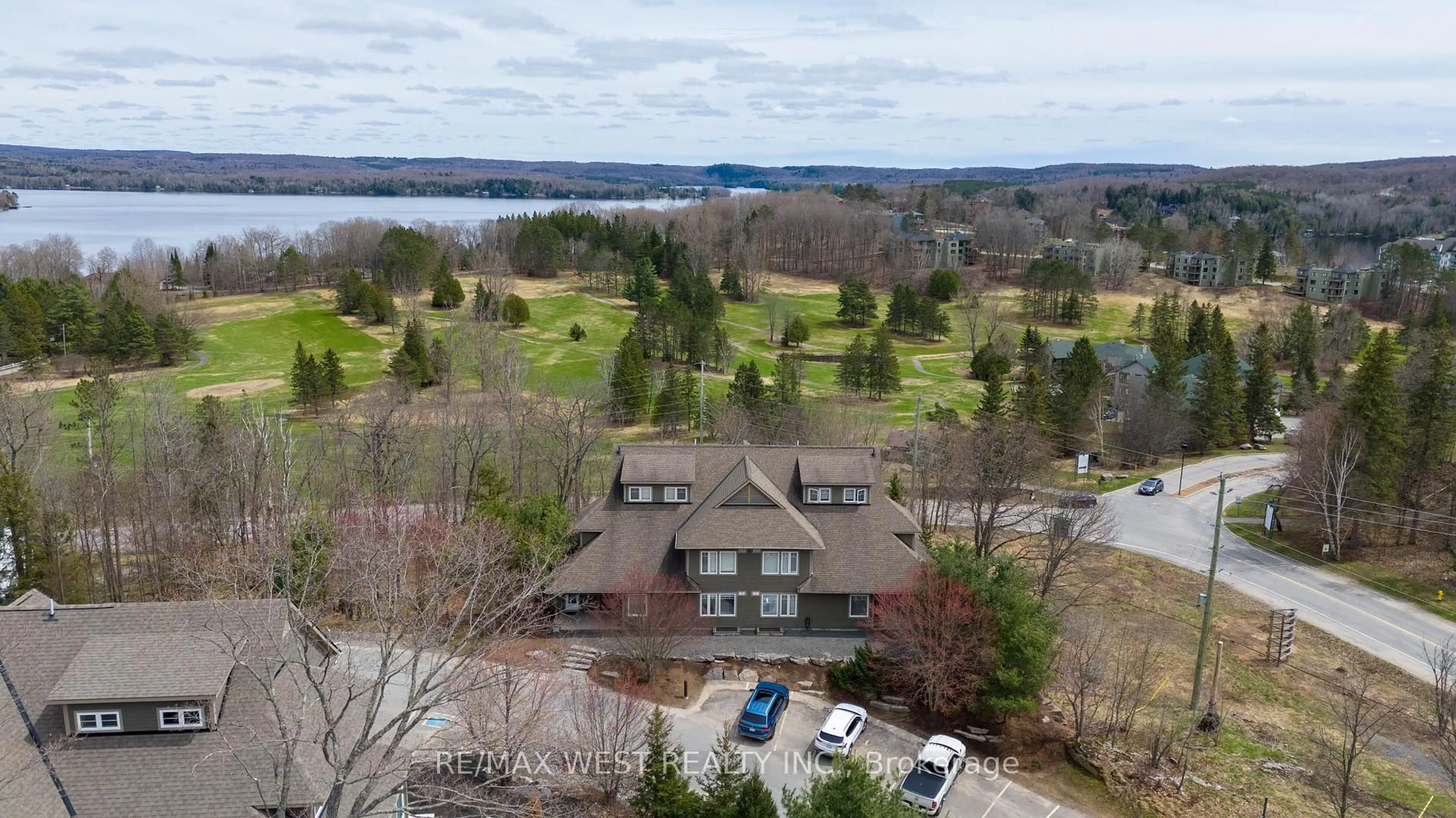 A pic from outside/outdoor area/front of a property/back of a property/a pic from drone, water/lake/river/ocean view for 1 Tree Tops Lane #201, Huntsville Ontario P1H 1A9