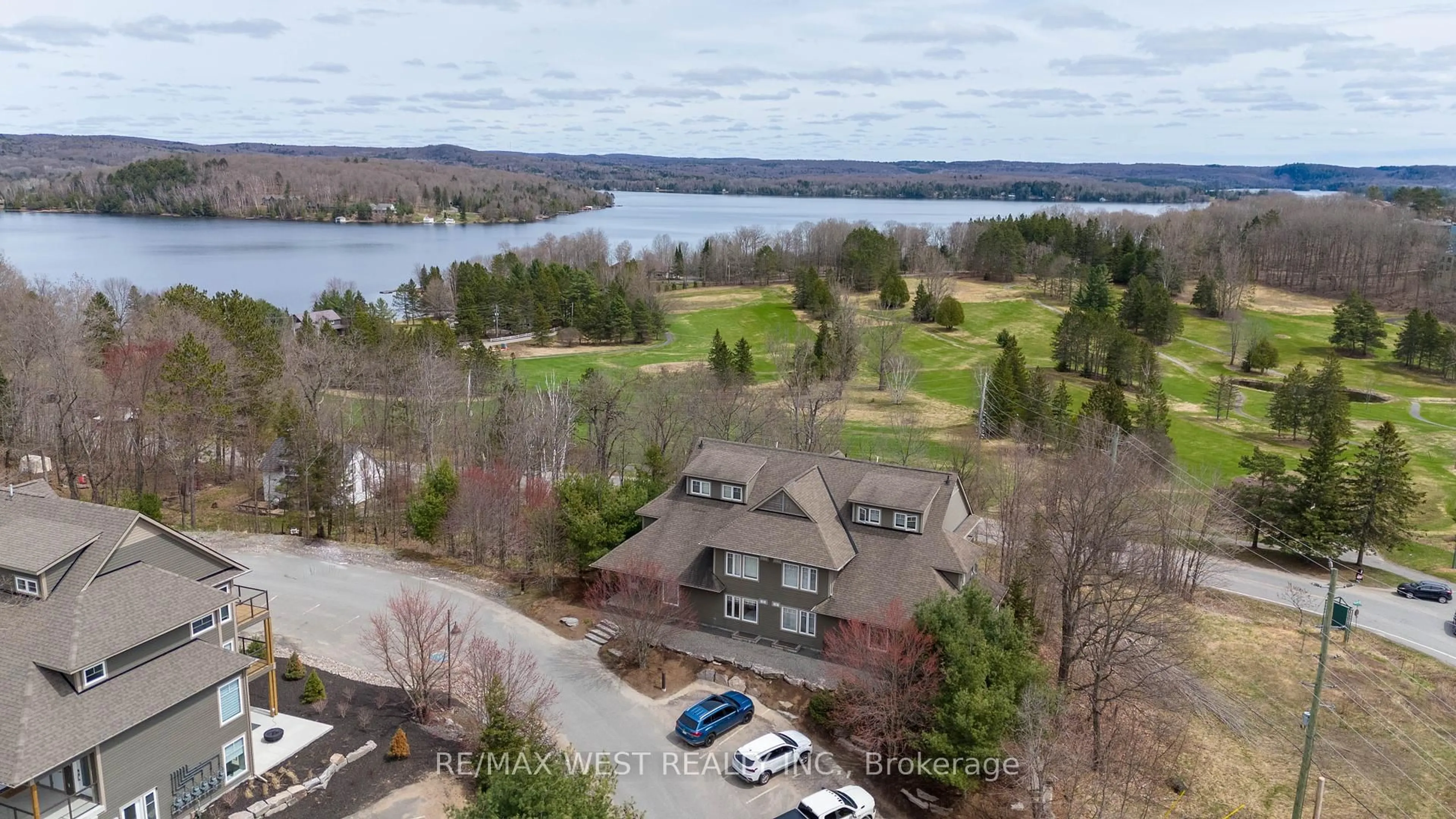 A pic from outside/outdoor area/front of a property/back of a property/a pic from drone, water/lake/river/ocean view for 1 Tree Tops Lane #201, Huntsville Ontario P1H 1A9