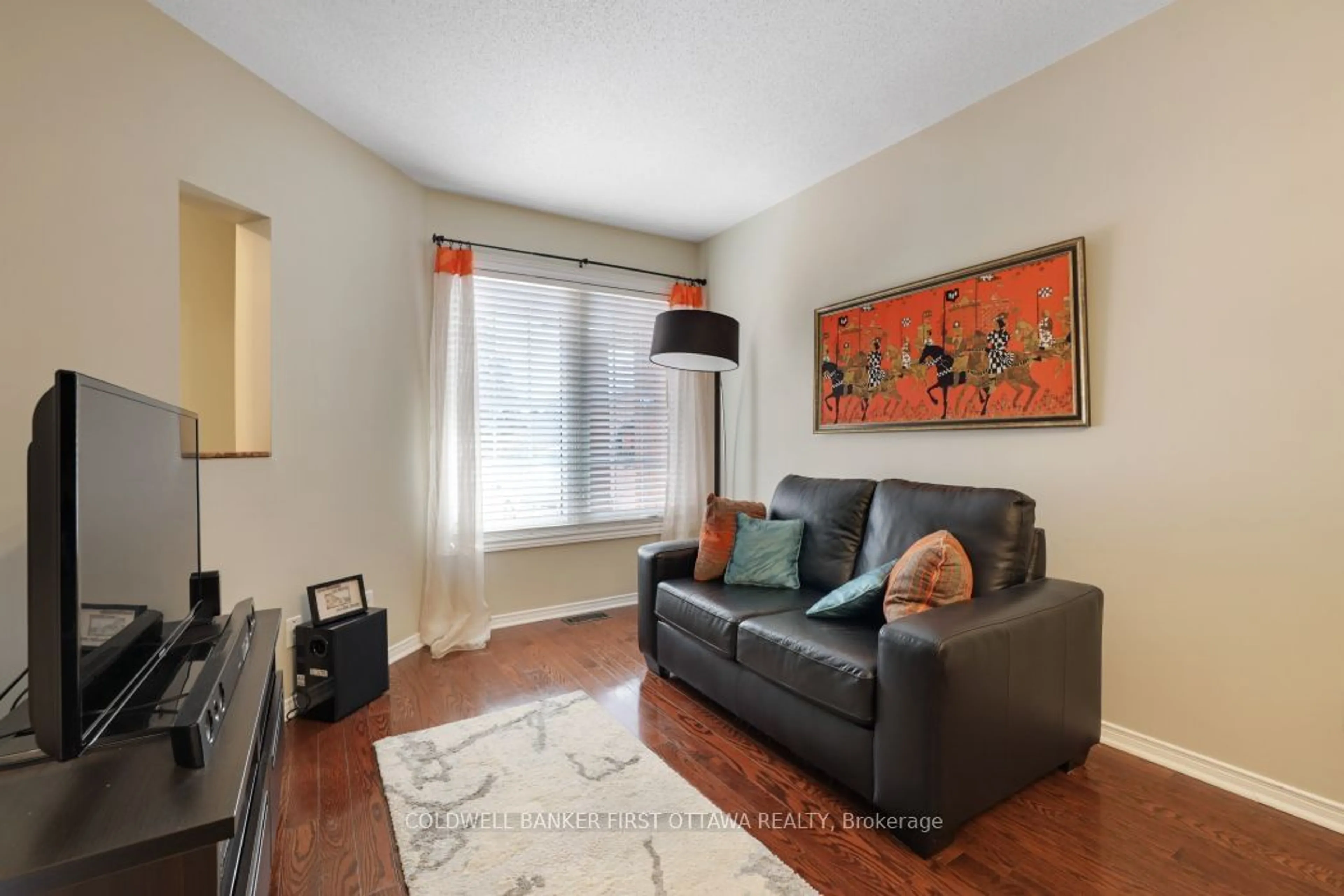 Living room with furniture, wood/laminate floor for 5 Margrave Ave, Hunt Club - South Keys and Area Ontario K1T 3Y3