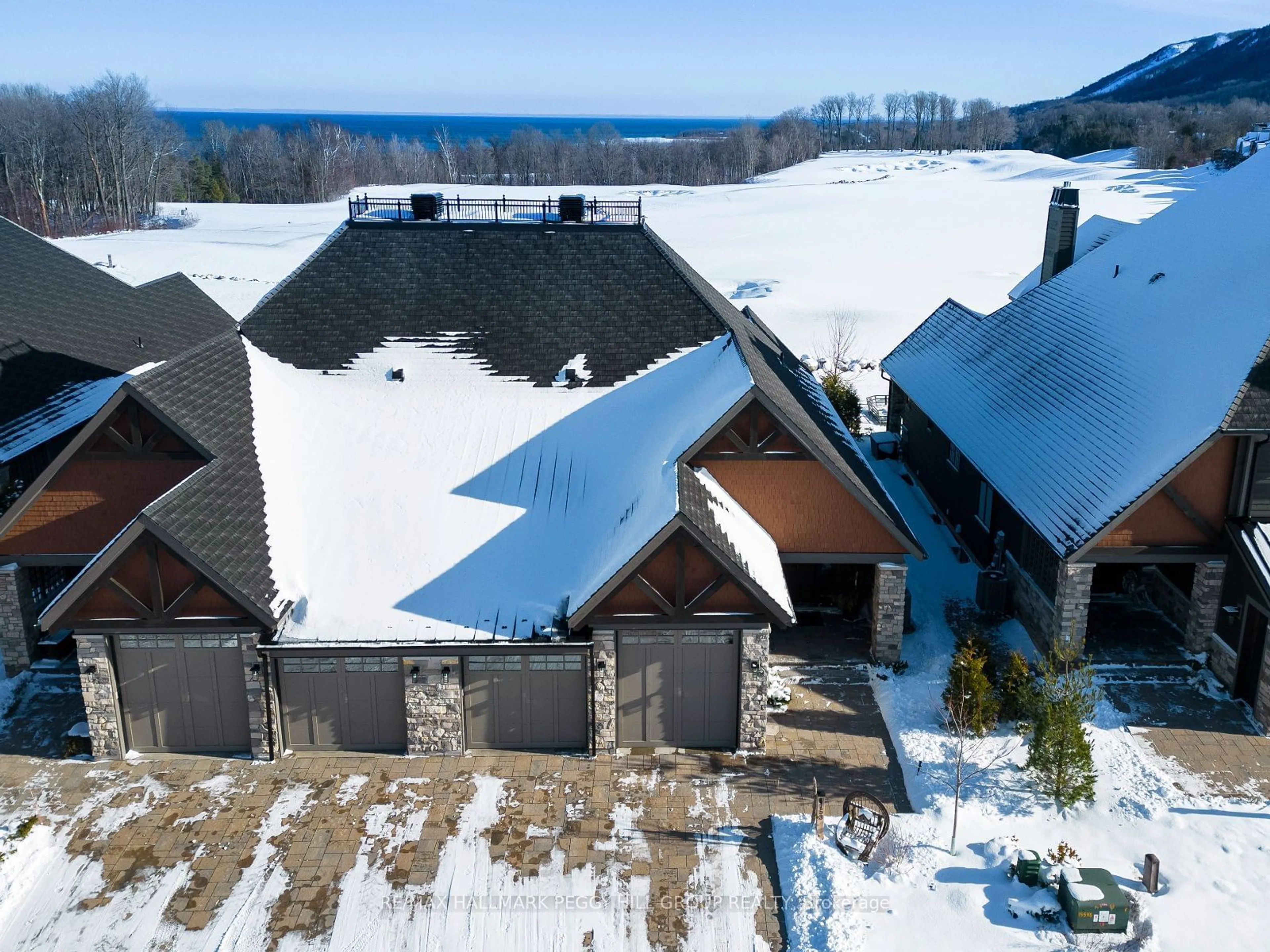 A pic from outside/outdoor area/front of a property/back of a property/a pic from drone, mountain view for 153 Georgian Bay Lane, Blue Mountains Ontario N0H 1J0