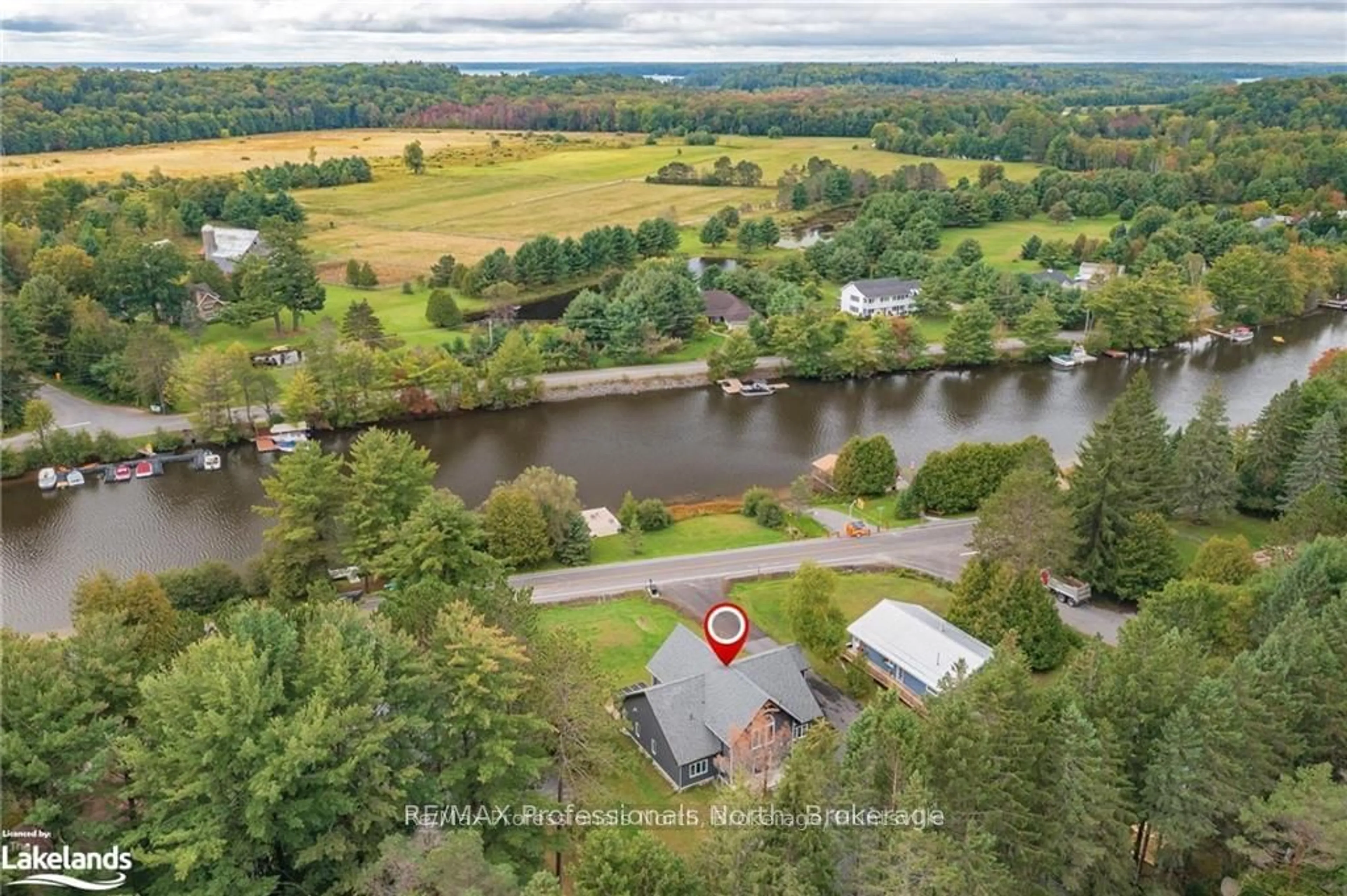 A pic from outside/outdoor area/front of a property/back of a property/a pic from drone, water/lake/river/ocean view for 379 Santas Village Rd, Bracebridge Ontario P1H 1W8