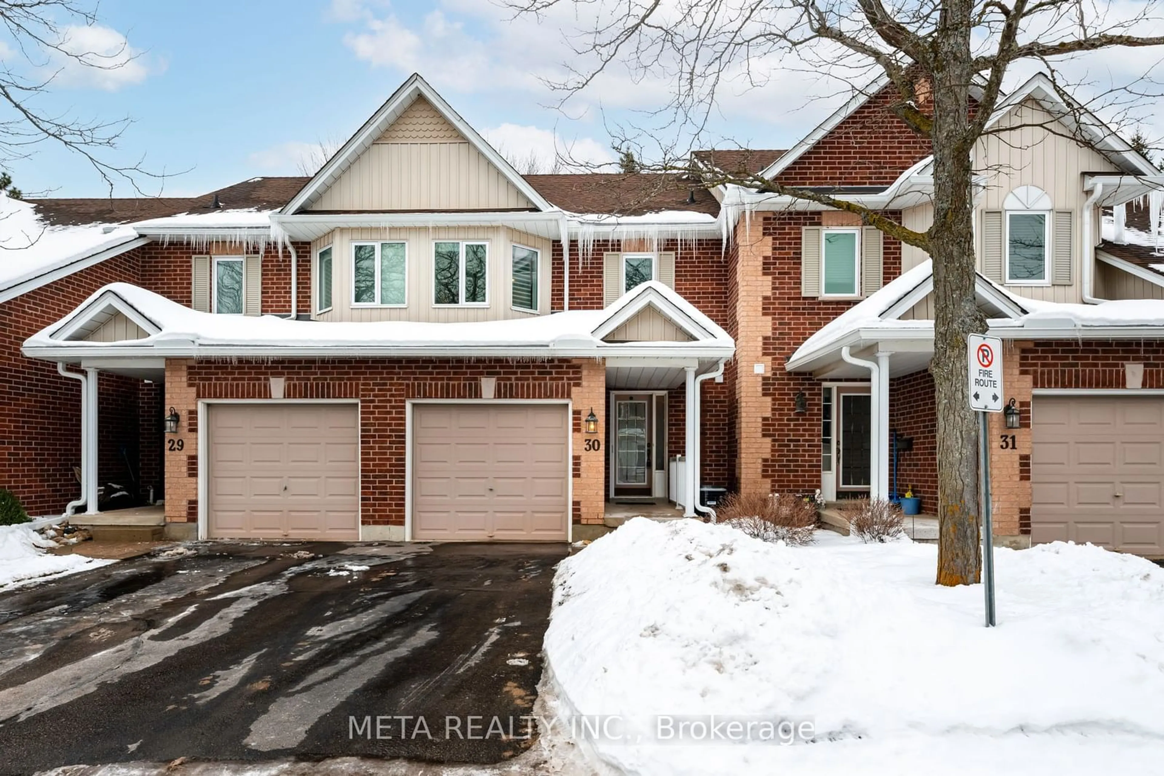 Home with brick exterior material, street for 39 Ptarmigan Dr #30, Guelph Ontario N1C 1E8