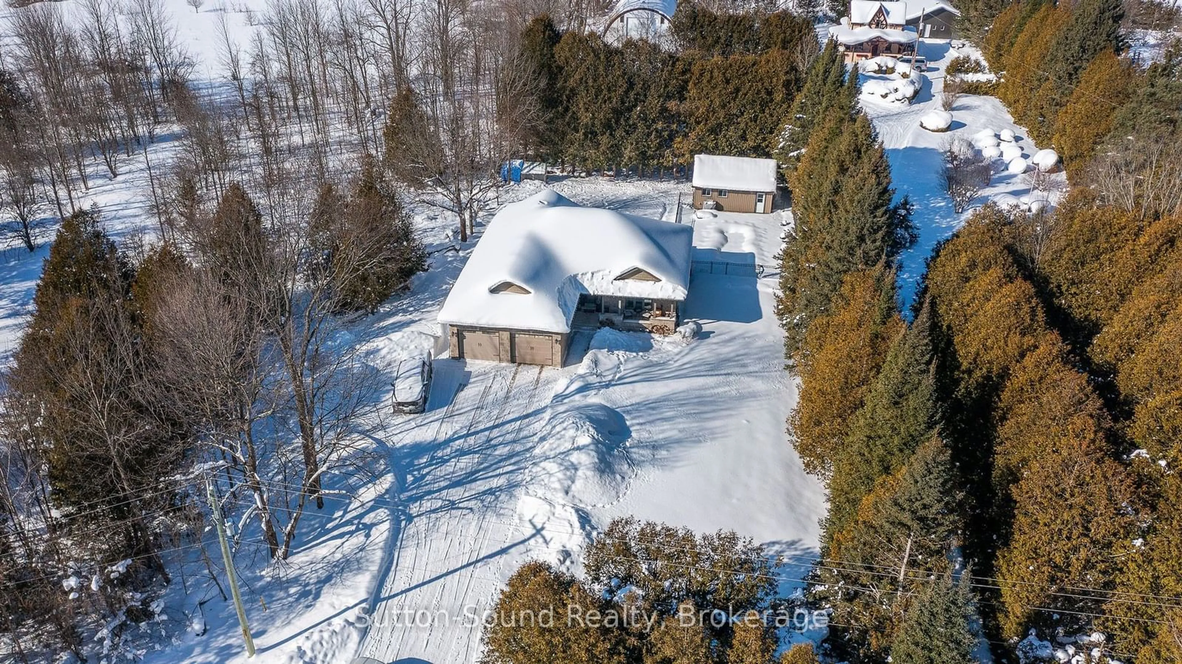 A pic from outside/outdoor area/front of a property/back of a property/a pic from drone, street for 318790 Grey Road 1 Rd, Georgian Bluffs Ontario N4K 5N4