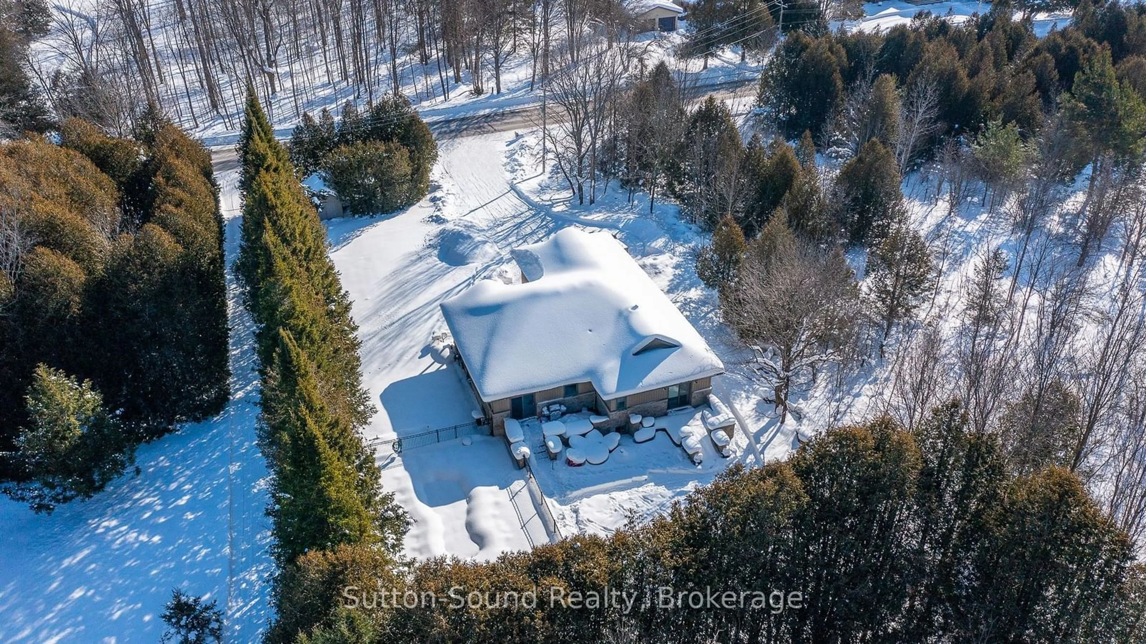 A pic from outside/outdoor area/front of a property/back of a property/a pic from drone, street for 318790 Grey Road 1 Rd, Georgian Bluffs Ontario N4K 5N4