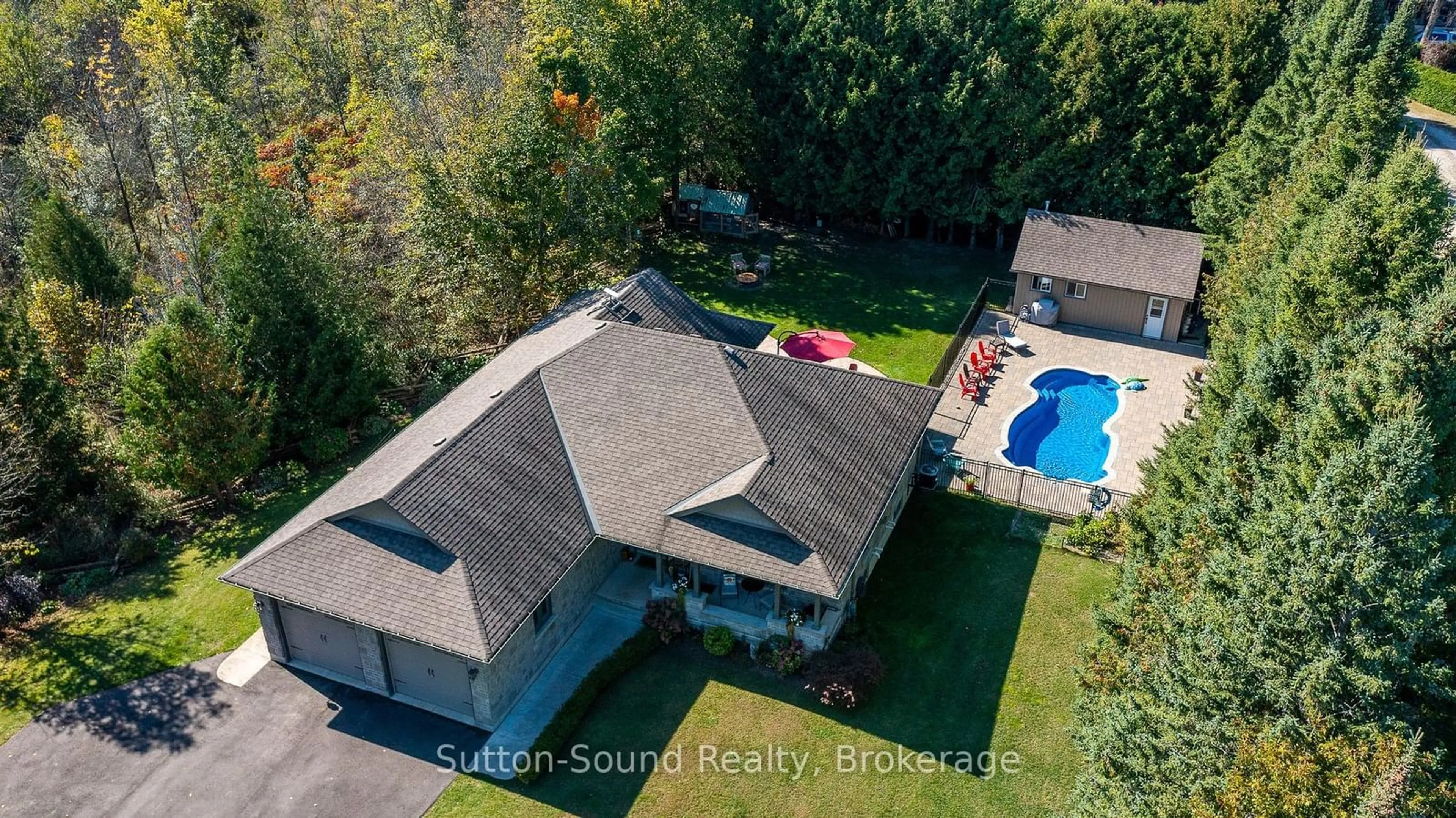 A pic from outside/outdoor area/front of a property/back of a property/a pic from drone, unknown for 318790 Grey Road 1 Rd, Georgian Bluffs Ontario N4K 5N4