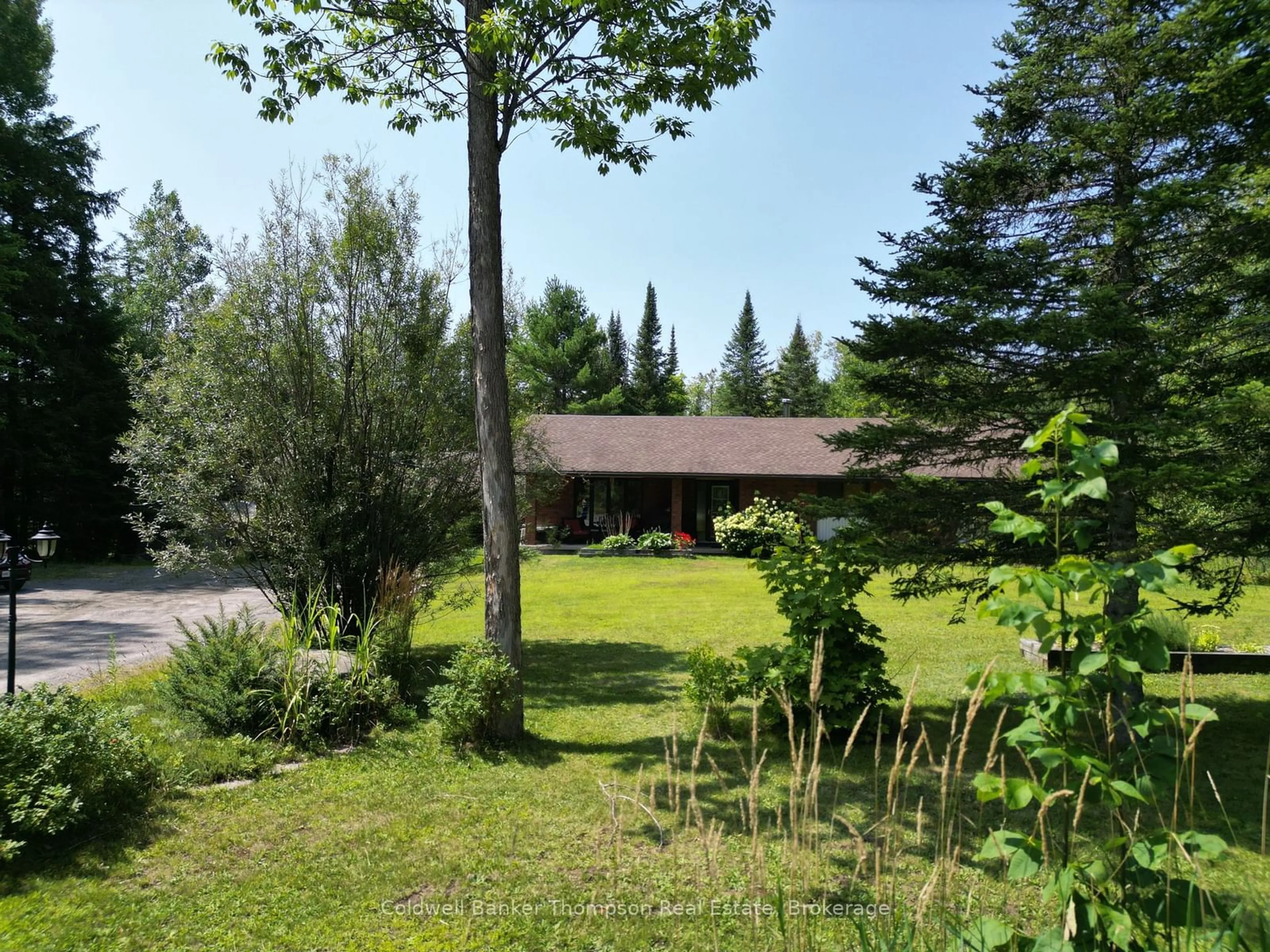 A pic from outside/outdoor area/front of a property/back of a property/a pic from drone, forest/trees view for 2551 Brunel Rd, Huntsville Ontario P1H 2J3