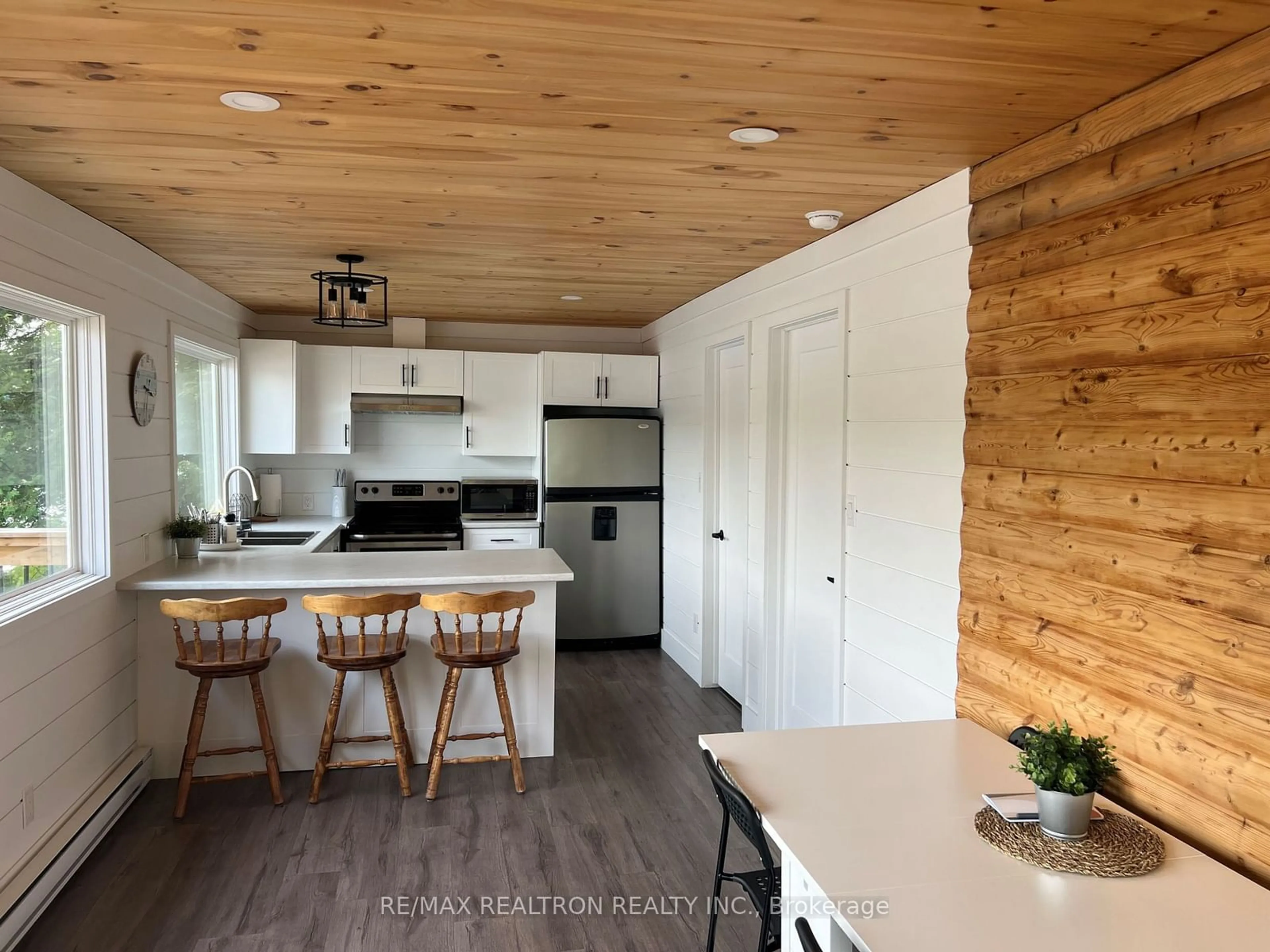 Open concept kitchen, wood/laminate floor for 203 Healey Lake, The Archipelago Ontario P0C 1H0