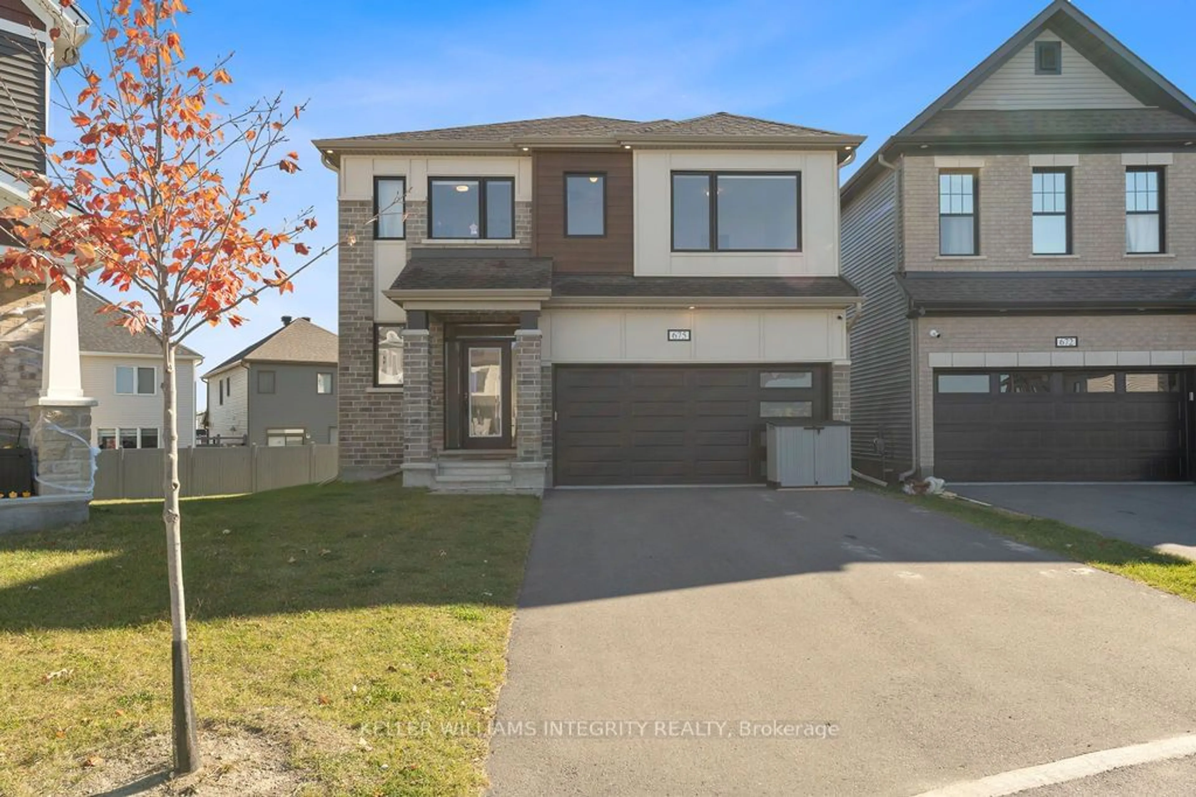 Home with brick exterior material, street for 675 Rye Grass Way, Barrhaven Ontario K2J 6Z8