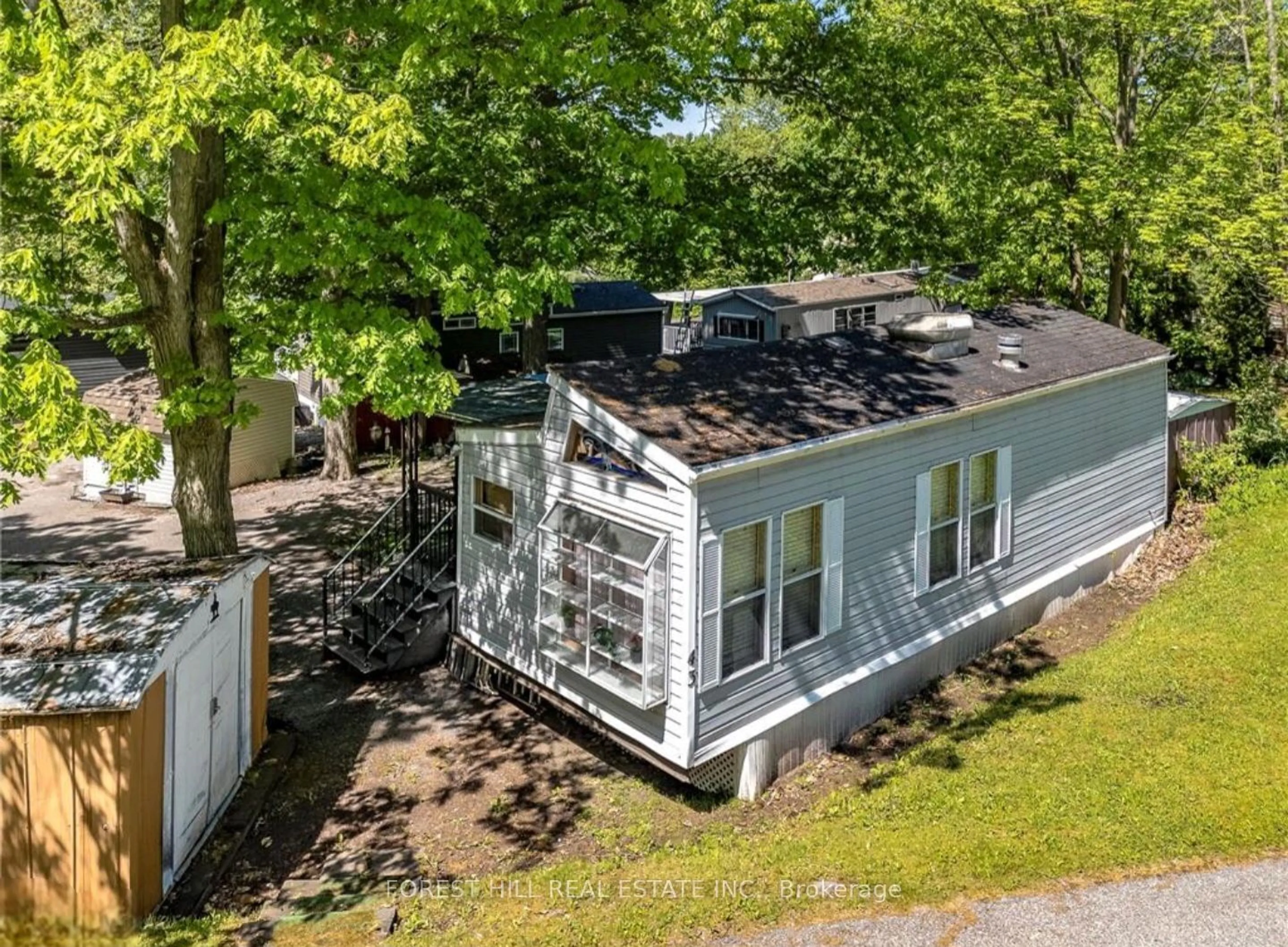 A pic from outside/outdoor area/front of a property/back of a property/a pic from drone, unknown for 164 Lone Pine Rd #183, Georgian Bay Ontario L0K 1S0