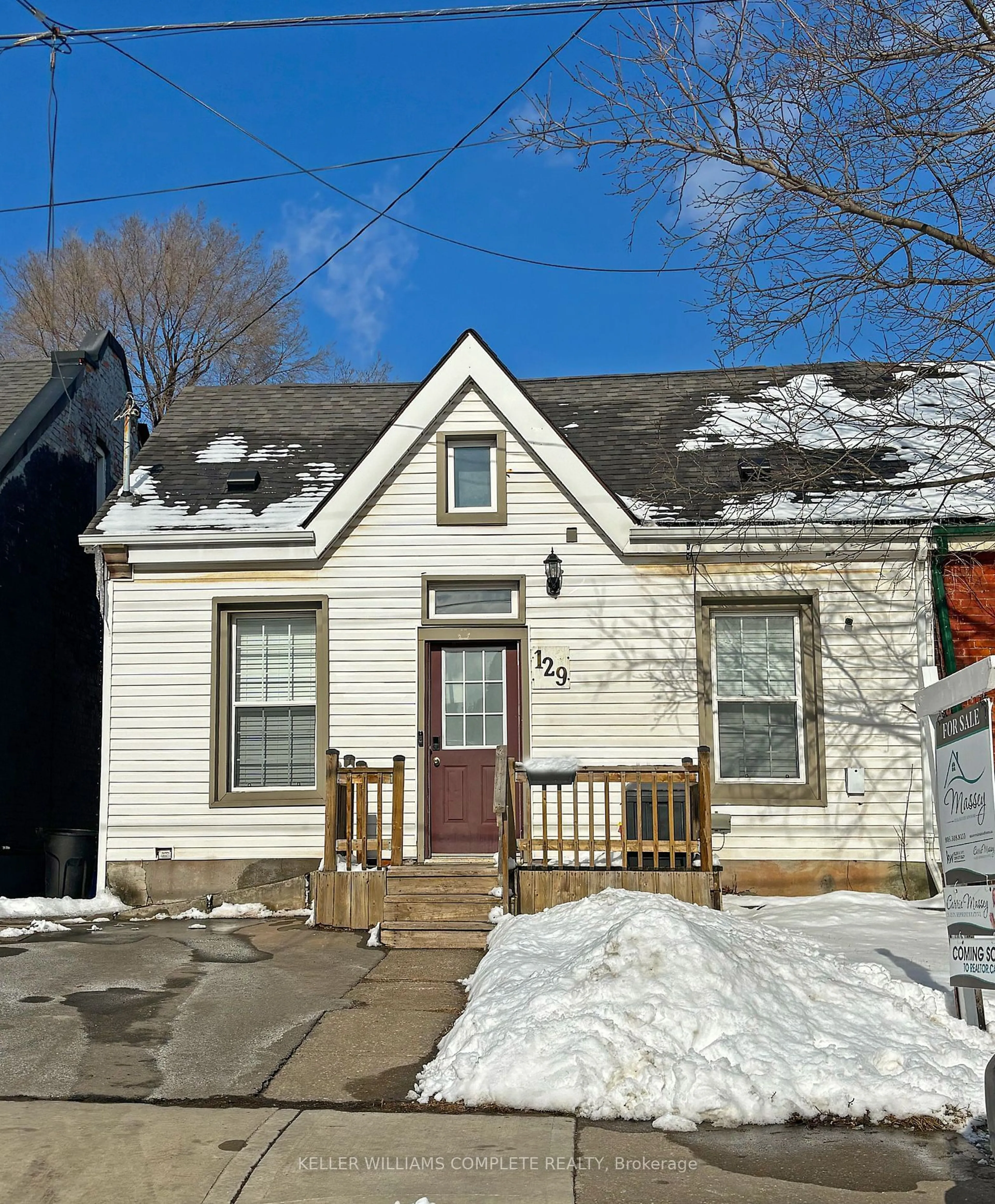 Home with vinyl exterior material, street for 129 Birge St, Hamilton Ontario L8L 3L6