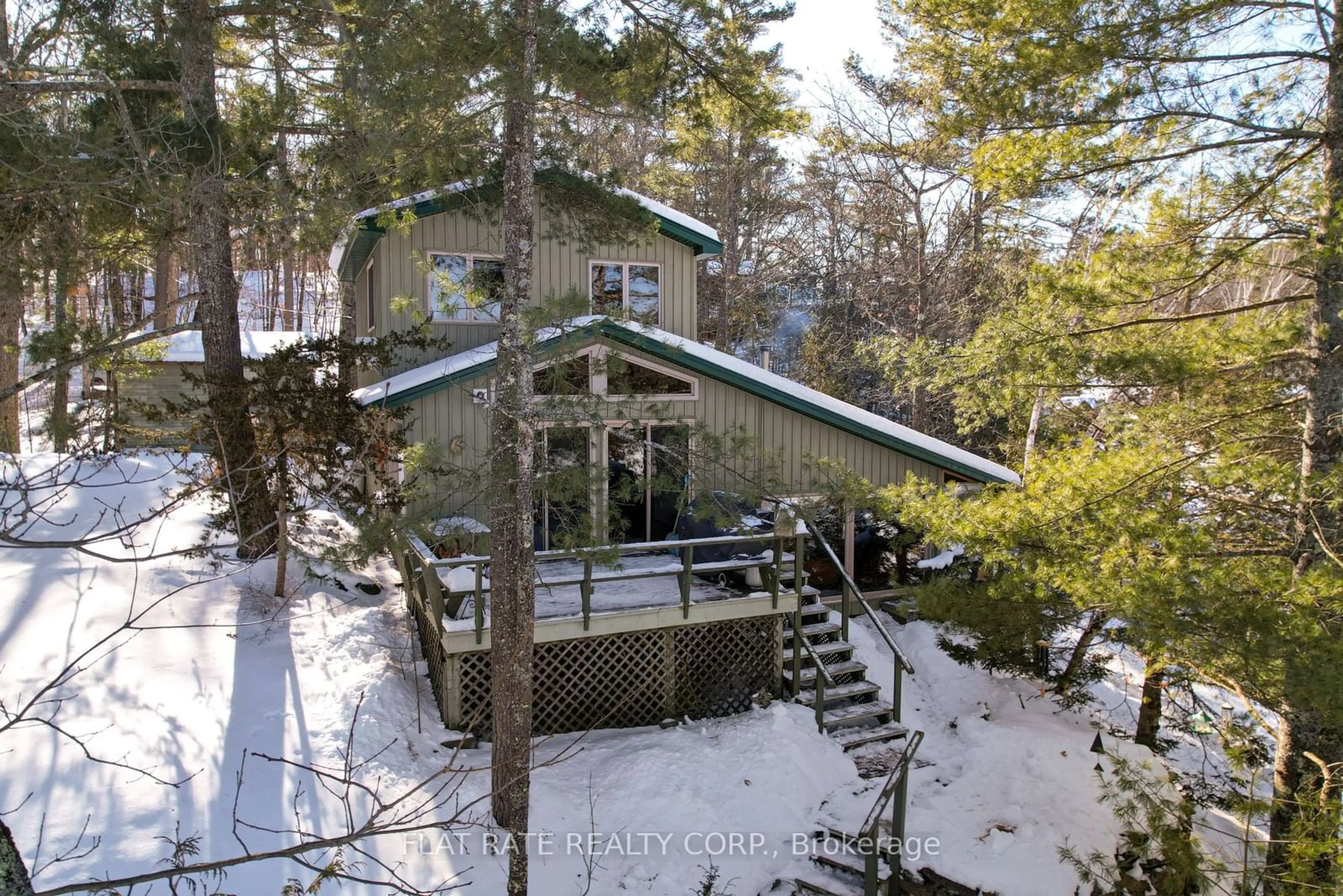 A pic from outside/outdoor area/front of a property/back of a property/a pic from drone, forest/trees view for 2711 Channel View Lane, Smith-Ennismore-Lakefield Ontario K0L 2H0