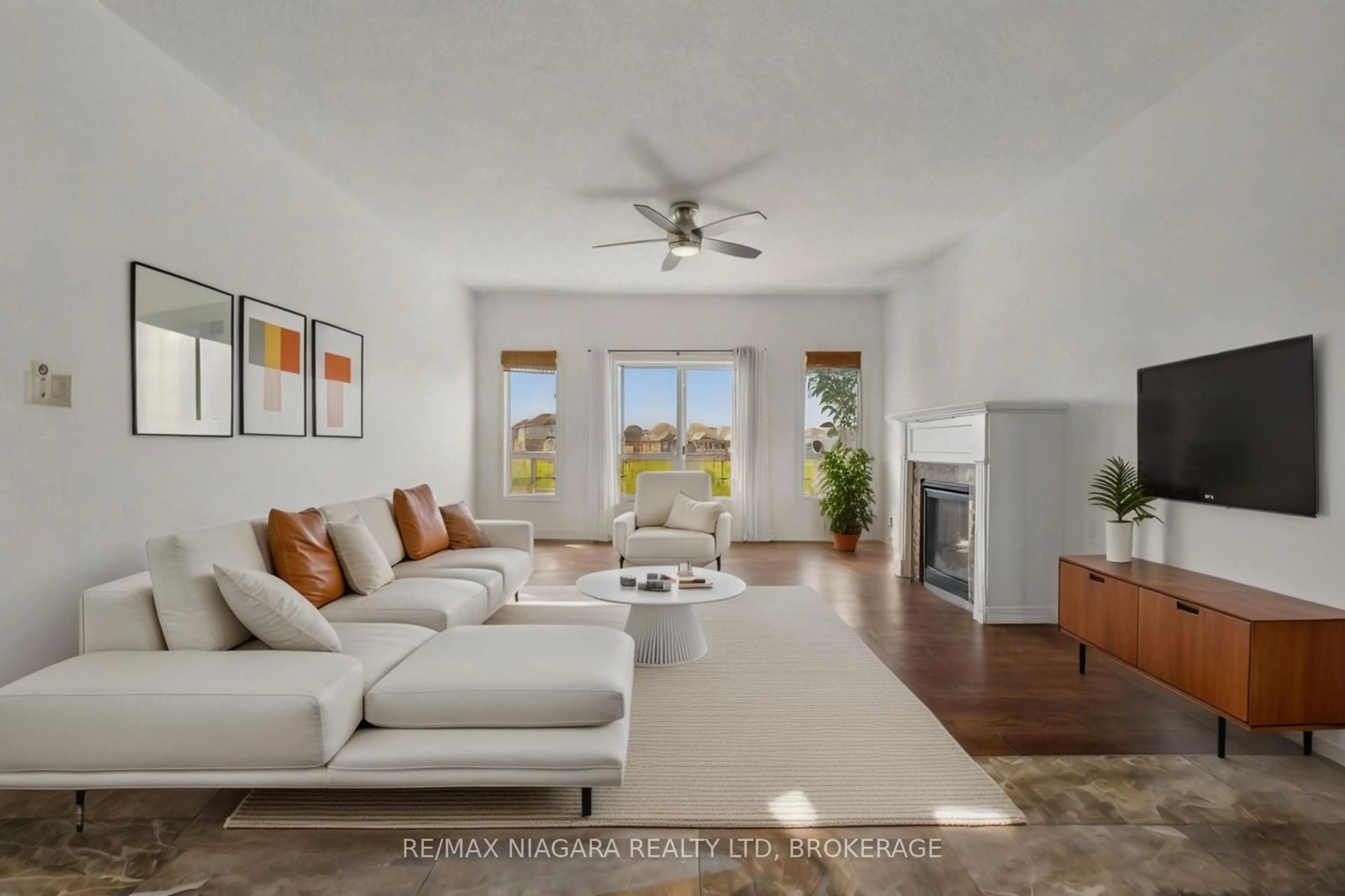 Living room with furniture, ceramic/tile floor for 4432 Cinnamon Grve, Niagara Falls Ontario L2G 0A4