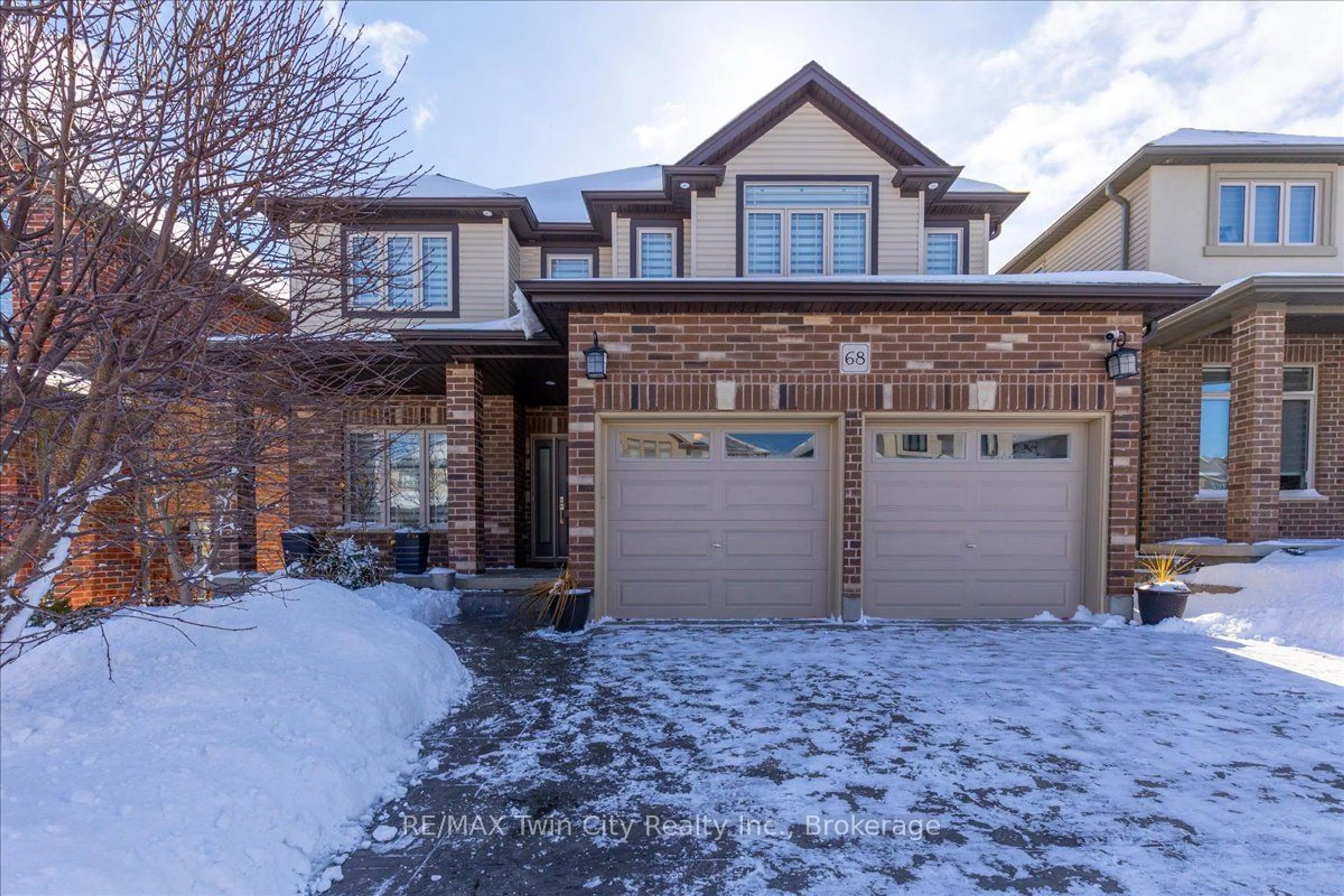 Home with brick exterior material, street for 68 Valleyscape Dr, Kitchener Ontario N2P 0G3