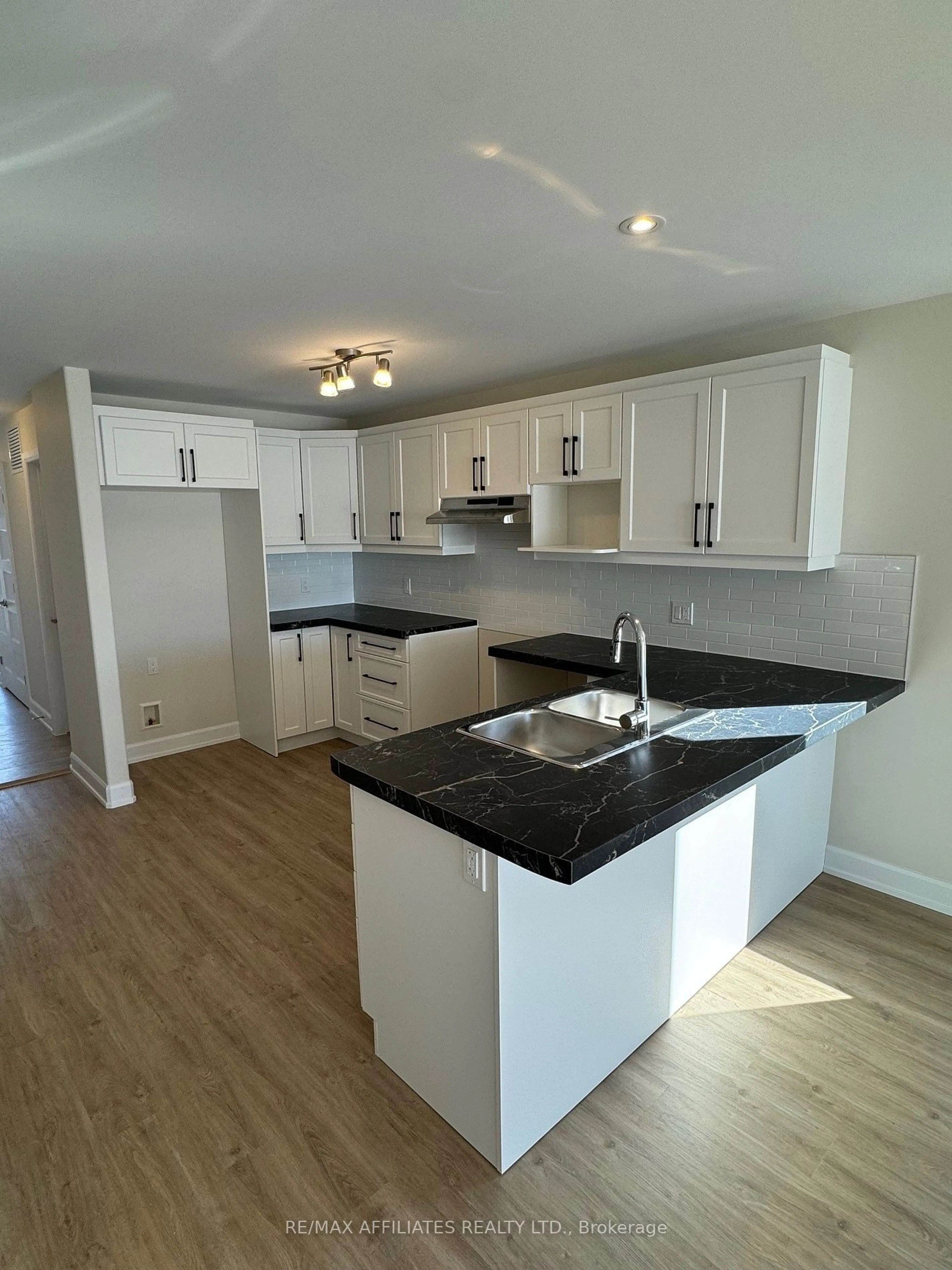 Open concept kitchen, wood/laminate floor for 1223 Montblanc Cres, Russell Ontario K0A 1W0