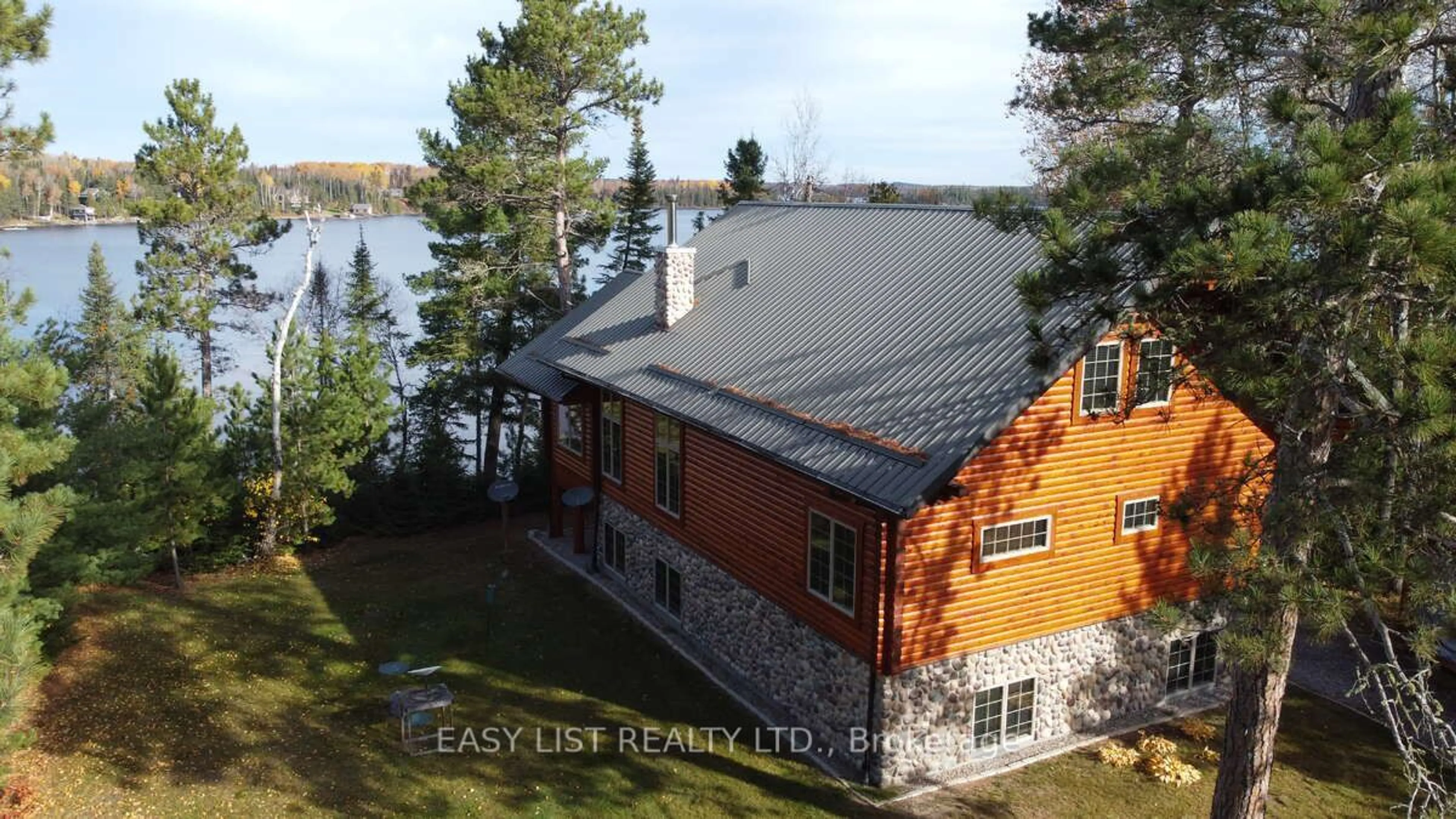 A pic from outside/outdoor area/front of a property/back of a property/a pic from drone, water/lake/river/ocean view for 1780 Southshore Dr, Sioux Lookout Ontario P8T 0A7