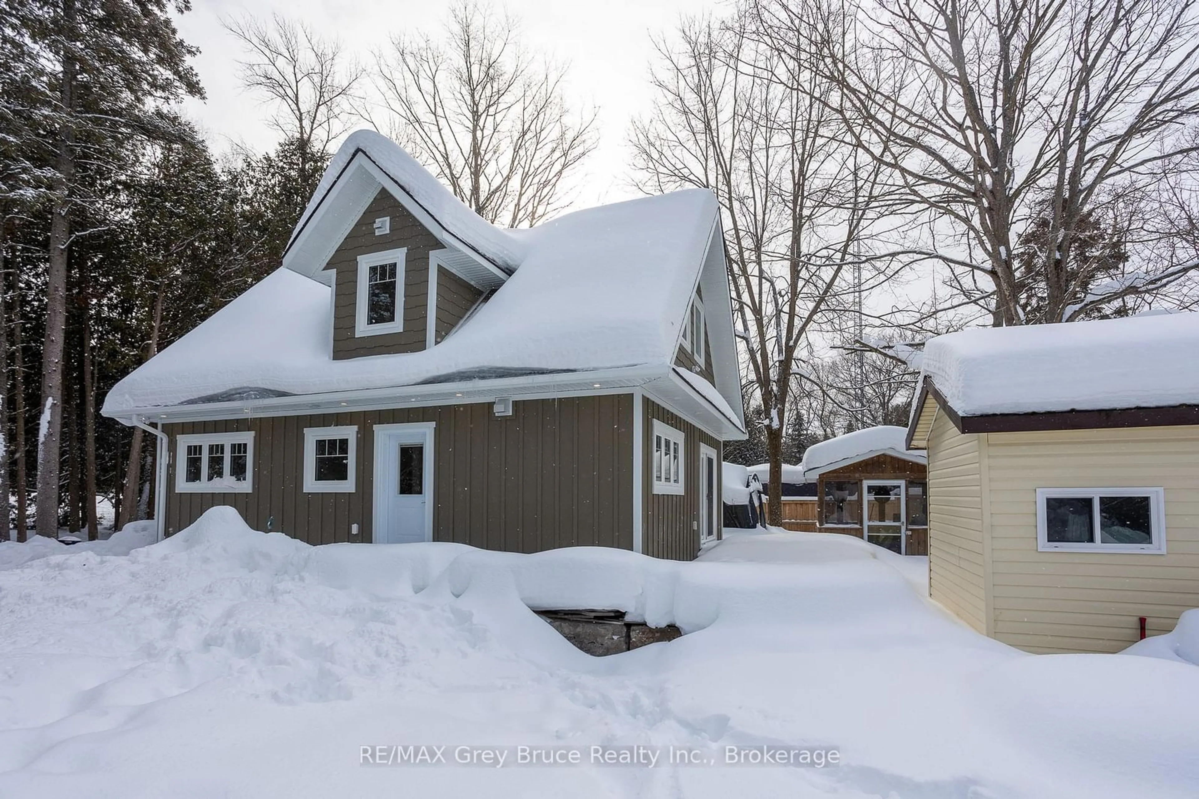 A pic from outside/outdoor area/front of a property/back of a property/a pic from drone, street for 457 Huron Rd Rd, South Bruce Peninsula Ontario N0H 2T0