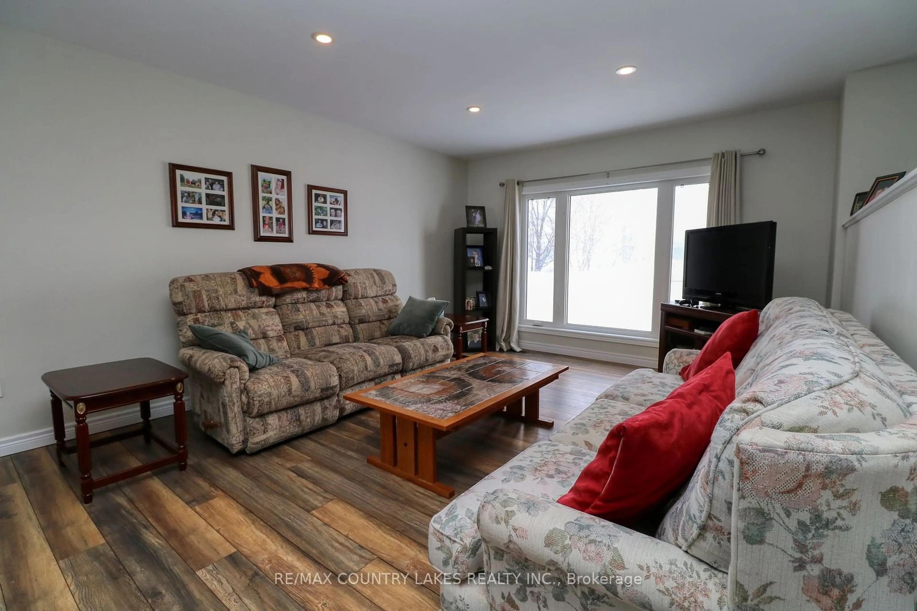 Living room with furniture, wood/laminate floor for 1067 County Road 46, Kawartha Lakes Ontario K0M 2T0