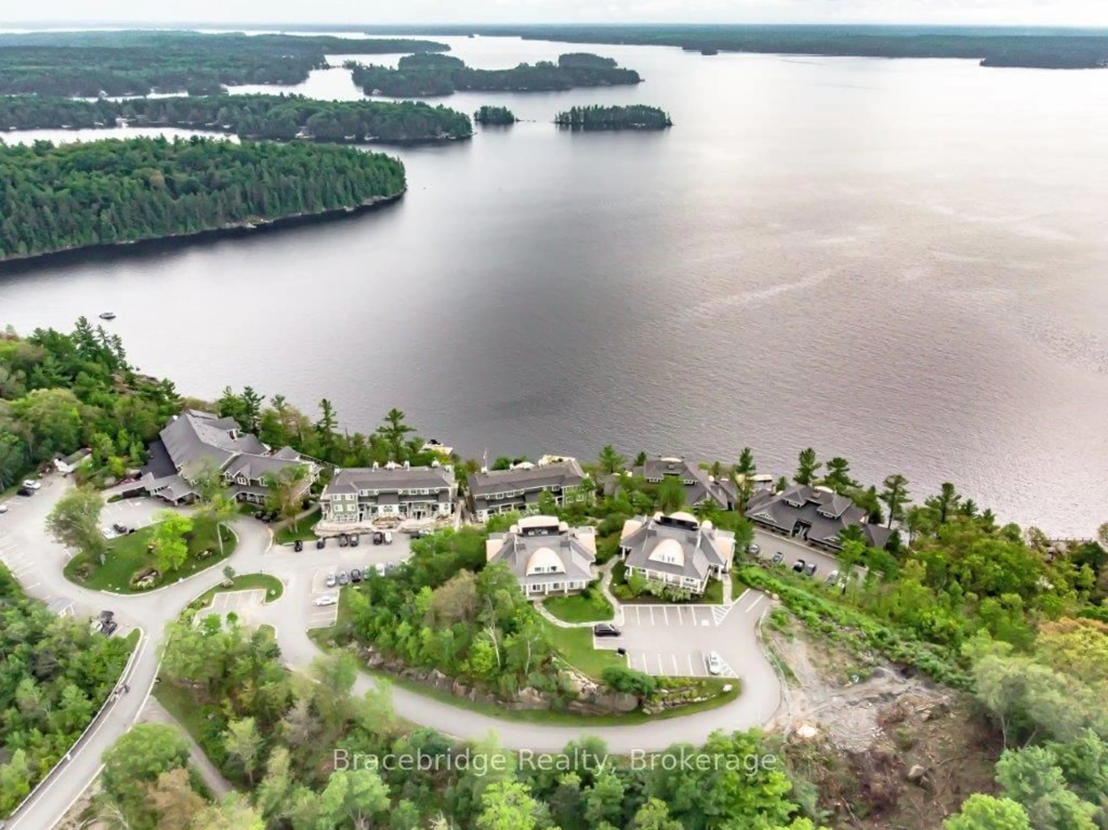 A pic from outside/outdoor area/front of a property/back of a property/a pic from drone, water/lake/river/ocean view for 1869 Muskoka 118 Rd #A102-A2, Muskoka Lakes Ontario P1L 1W8