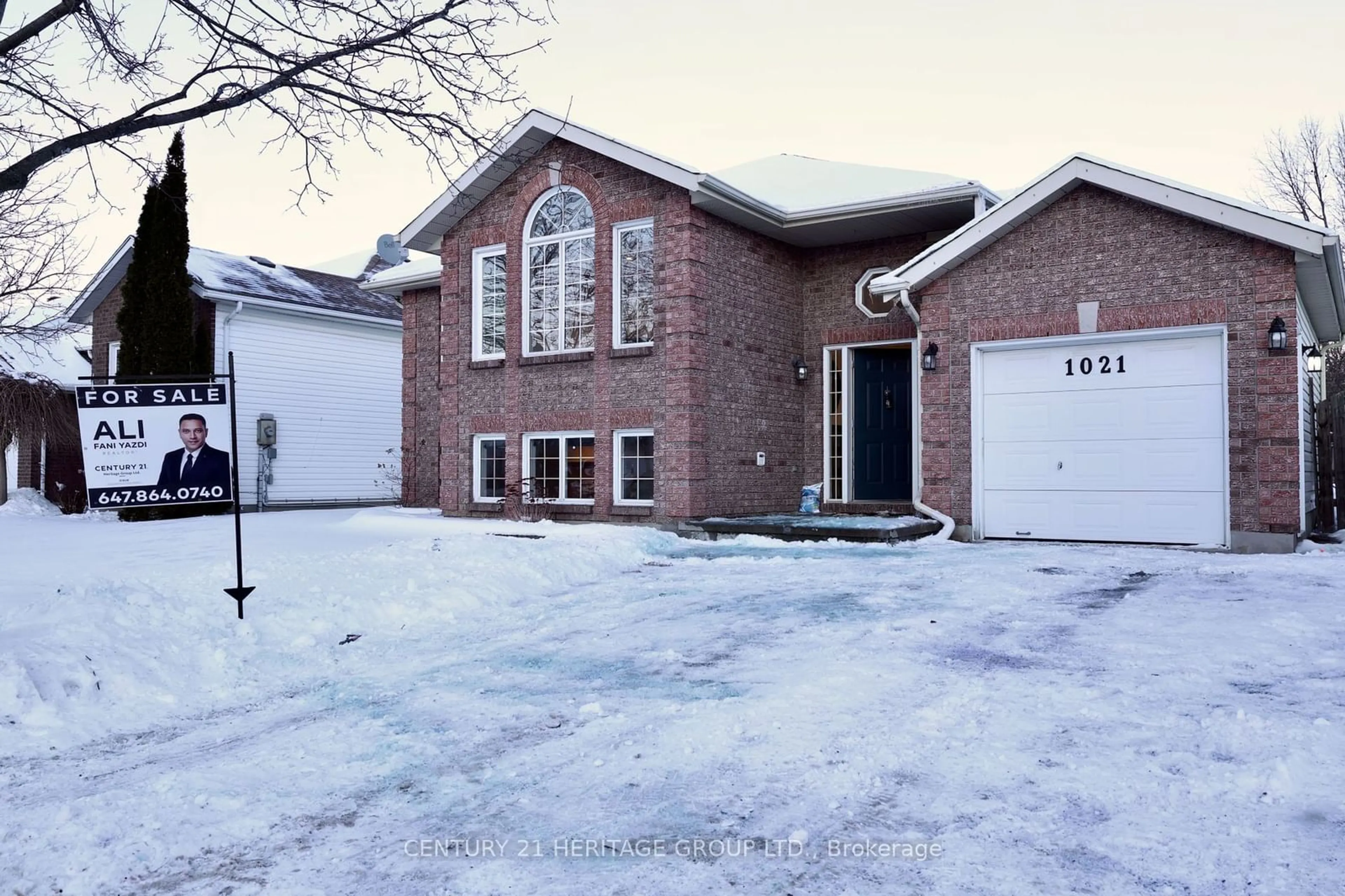 Home with brick exterior material, street for 1021 Greenwood Park Dr, Kingston Ontario K7K 7C2