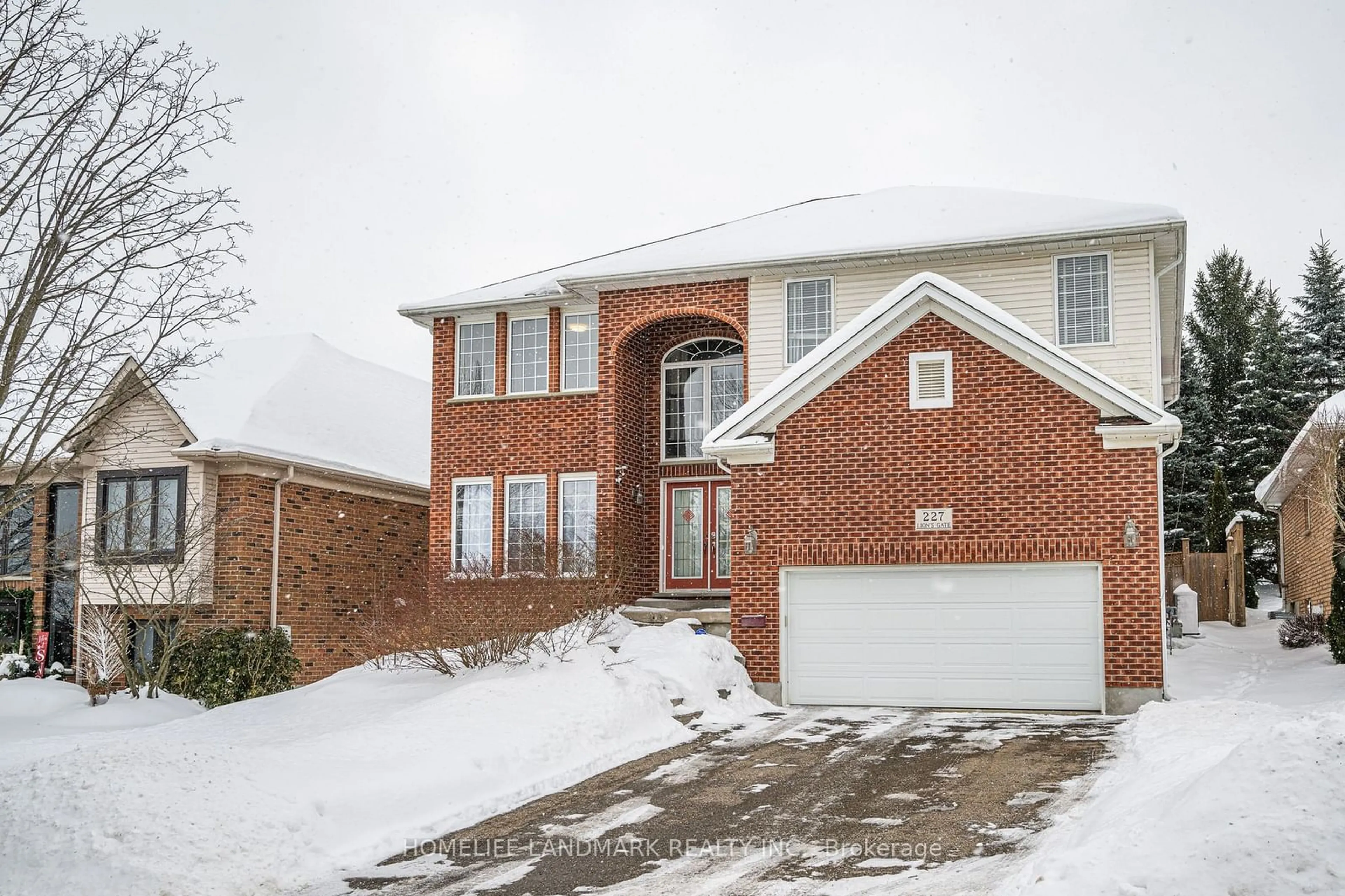 Home with brick exterior material, street for 227 The Lions Gate, Waterloo Ontario N2L 6M6