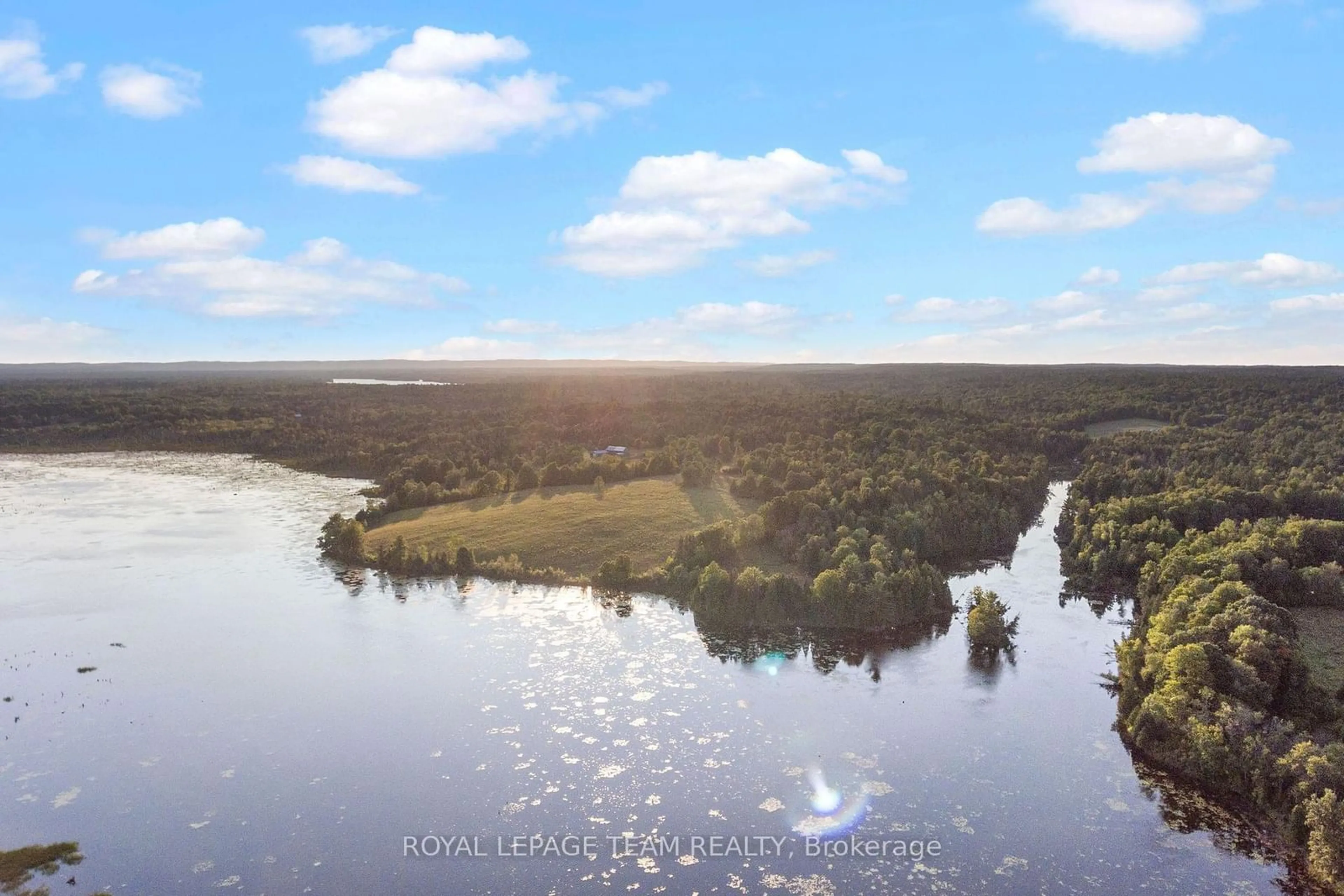 A pic from outside/outdoor area/front of a property/back of a property/a pic from drone, water/lake/river/ocean view for 105 Halliday Creek Rd, Greater Madawaska Ontario K0J 1G0