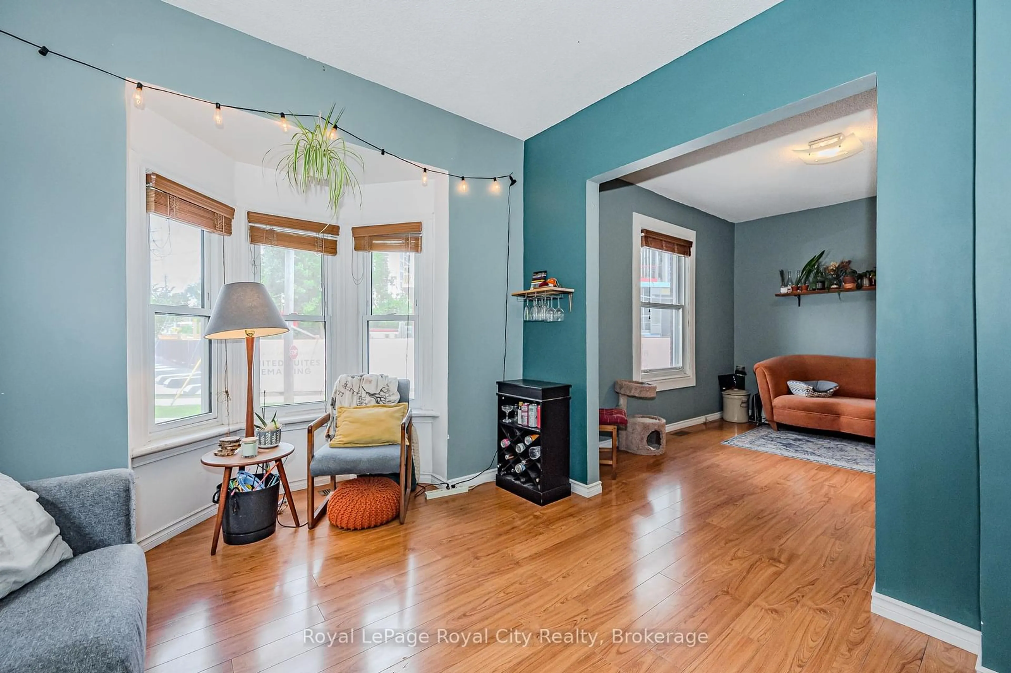 Living room with furniture, wood/laminate floor for 90 Neeve St, Guelph Ontario N1E 5S1
