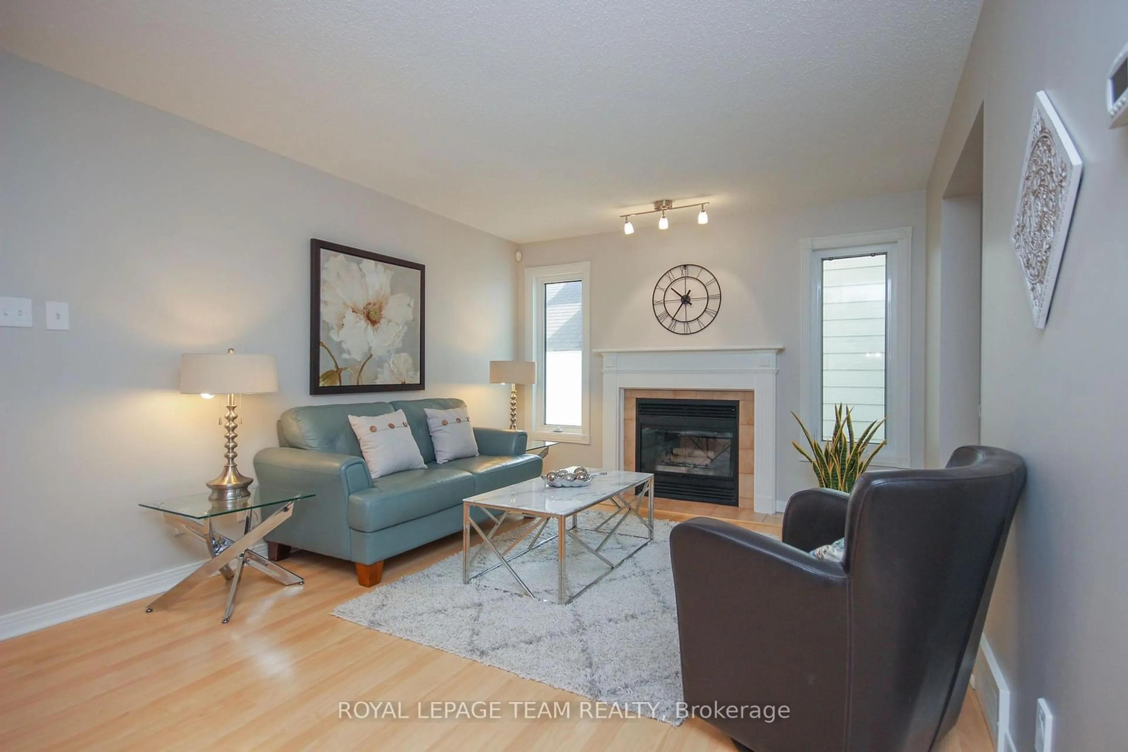 Living room with furniture, wood/laminate floor for 56 FORESTVIEW Cres, Bells Corners and South to Fallowfield Ontario K2H 9P5