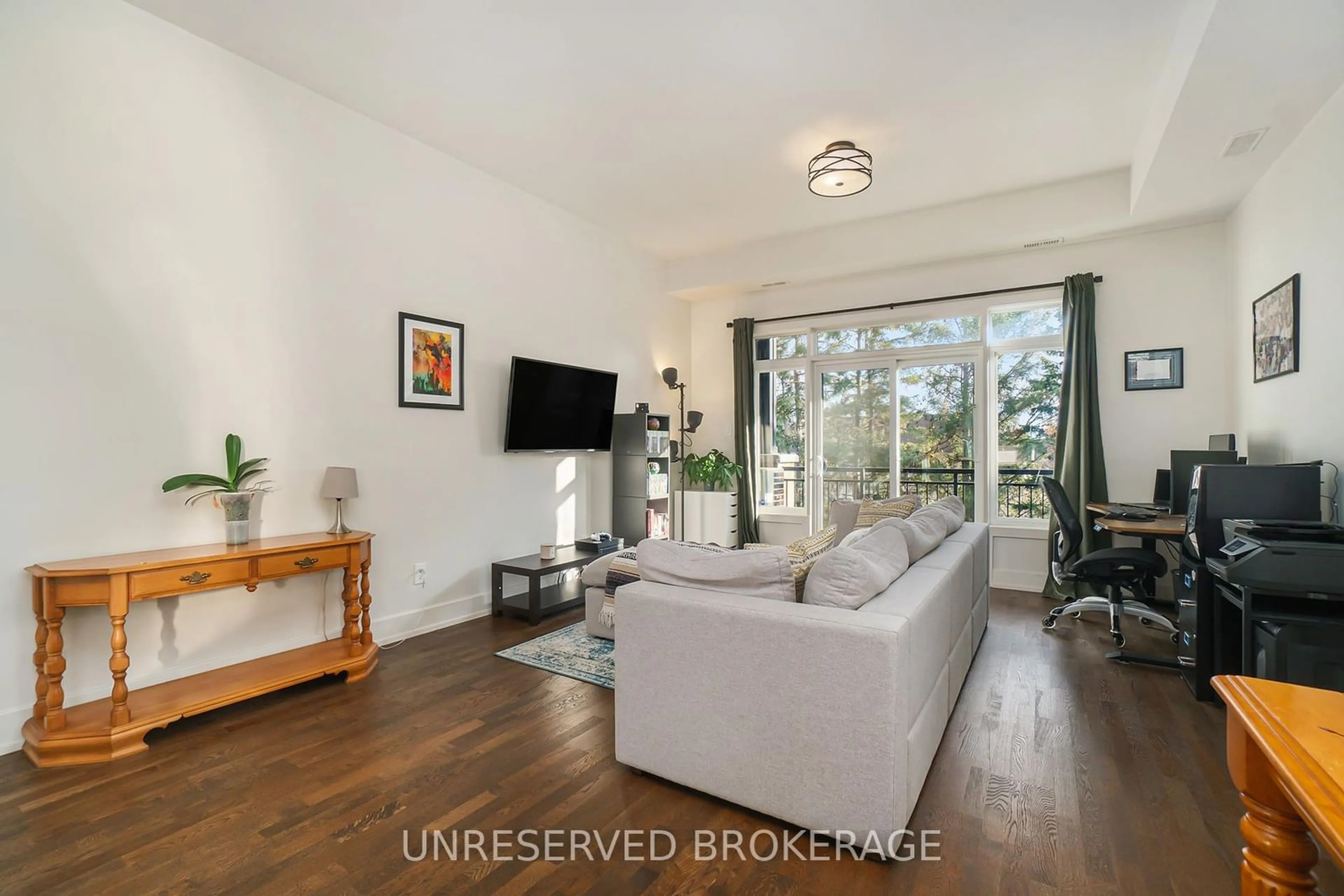 Living room with furniture, wood/laminate floor for 45 Bergeron, Orleans - Convent Glen and Area Ontario K1C 0C2