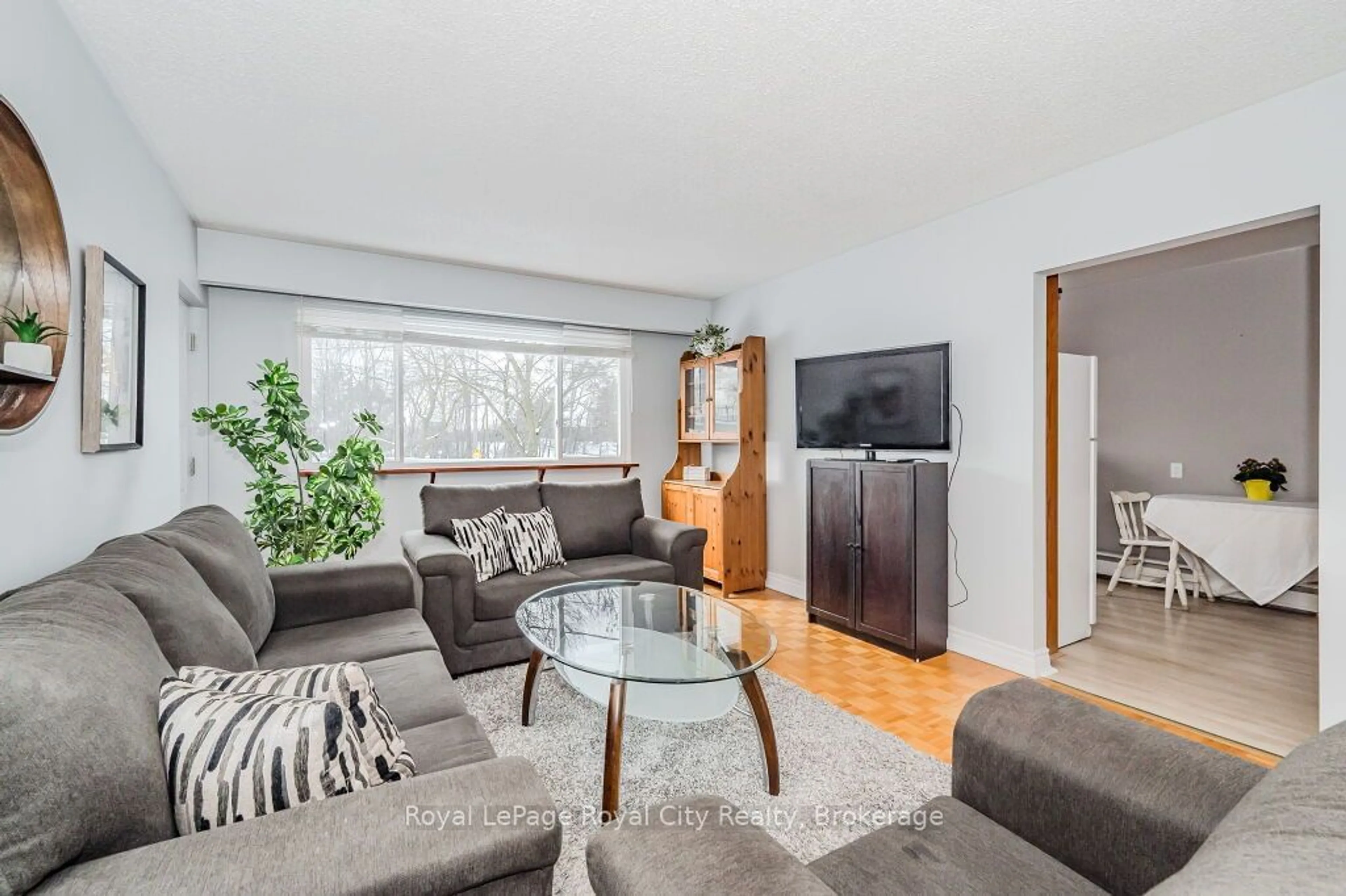 Living room with furniture, wood/laminate floor for 1 Sunnylea Cres #107, Guelph Ontario N1E 1W1