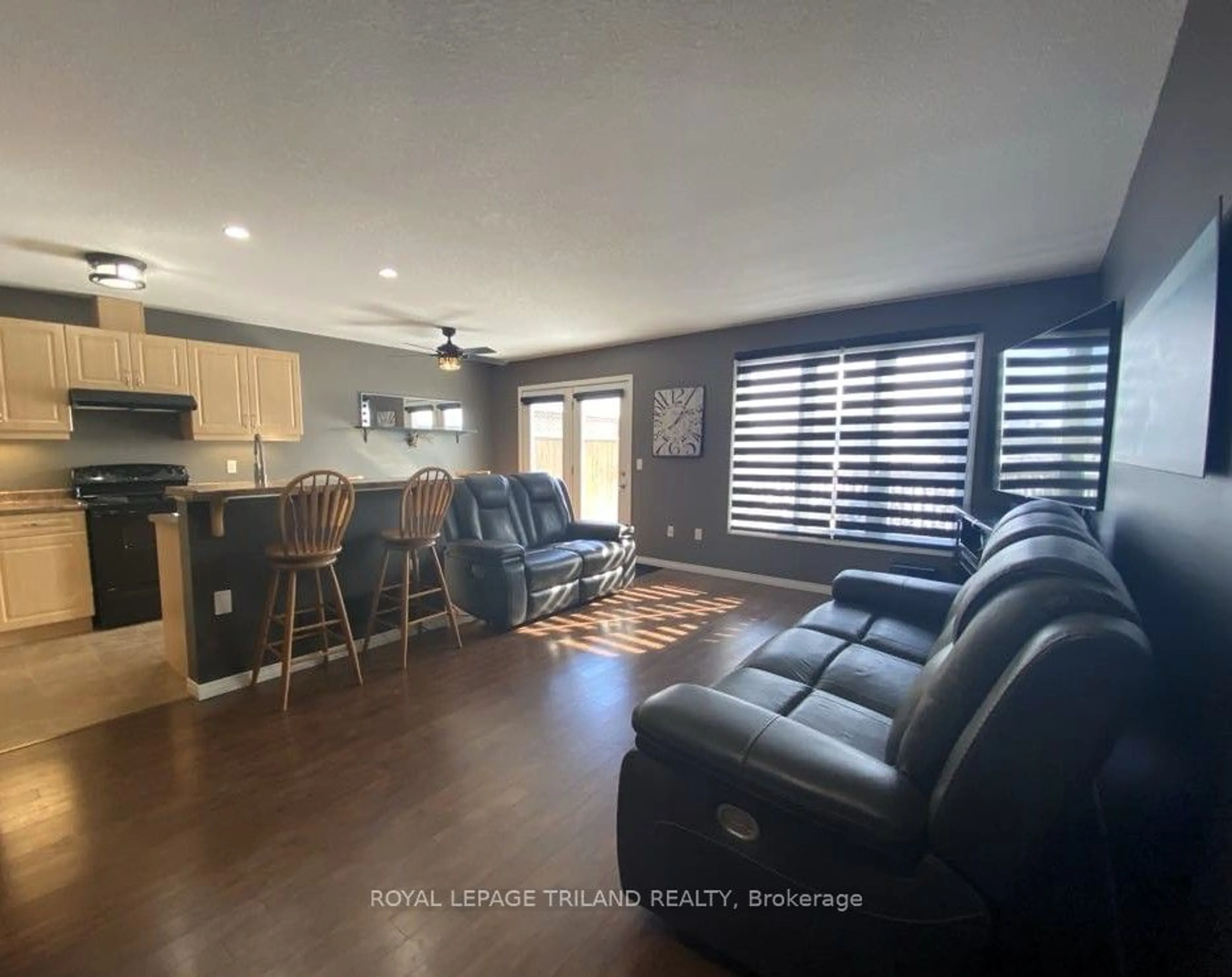 Living room with furniture, wood/laminate floor for 2145 North Routledge Park #37, London Ontario N6G 0J8