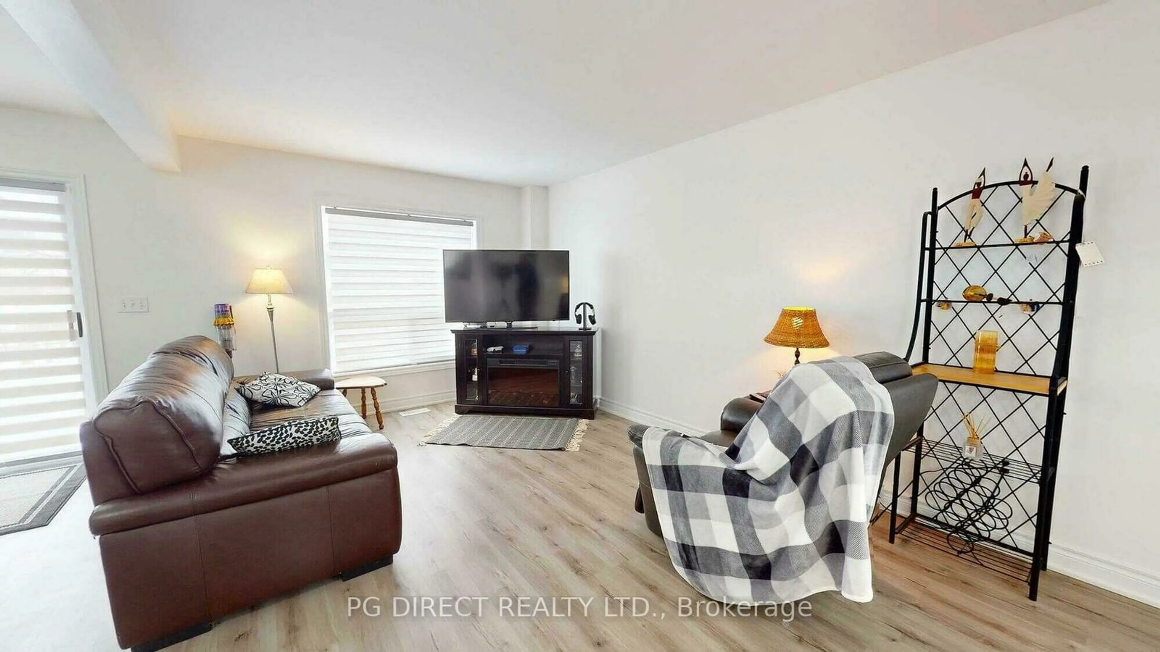 Living room with furniture, wood/laminate floor for 12 Mccurdy Rd, Guelph Ontario N1G 4Y6