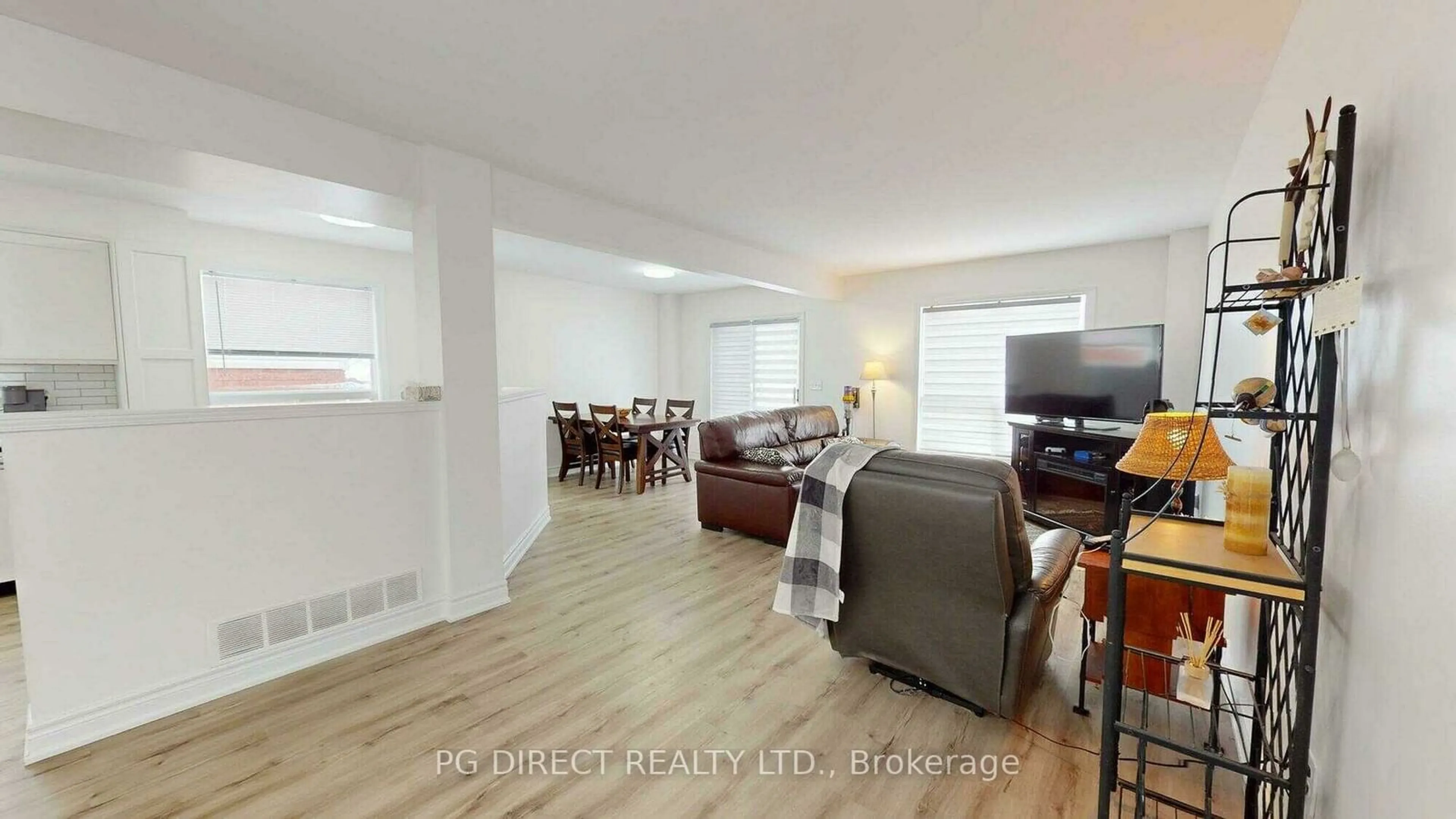 Living room with furniture, wood/laminate floor for 12 Mccurdy Rd, Guelph Ontario N1G 4Y6