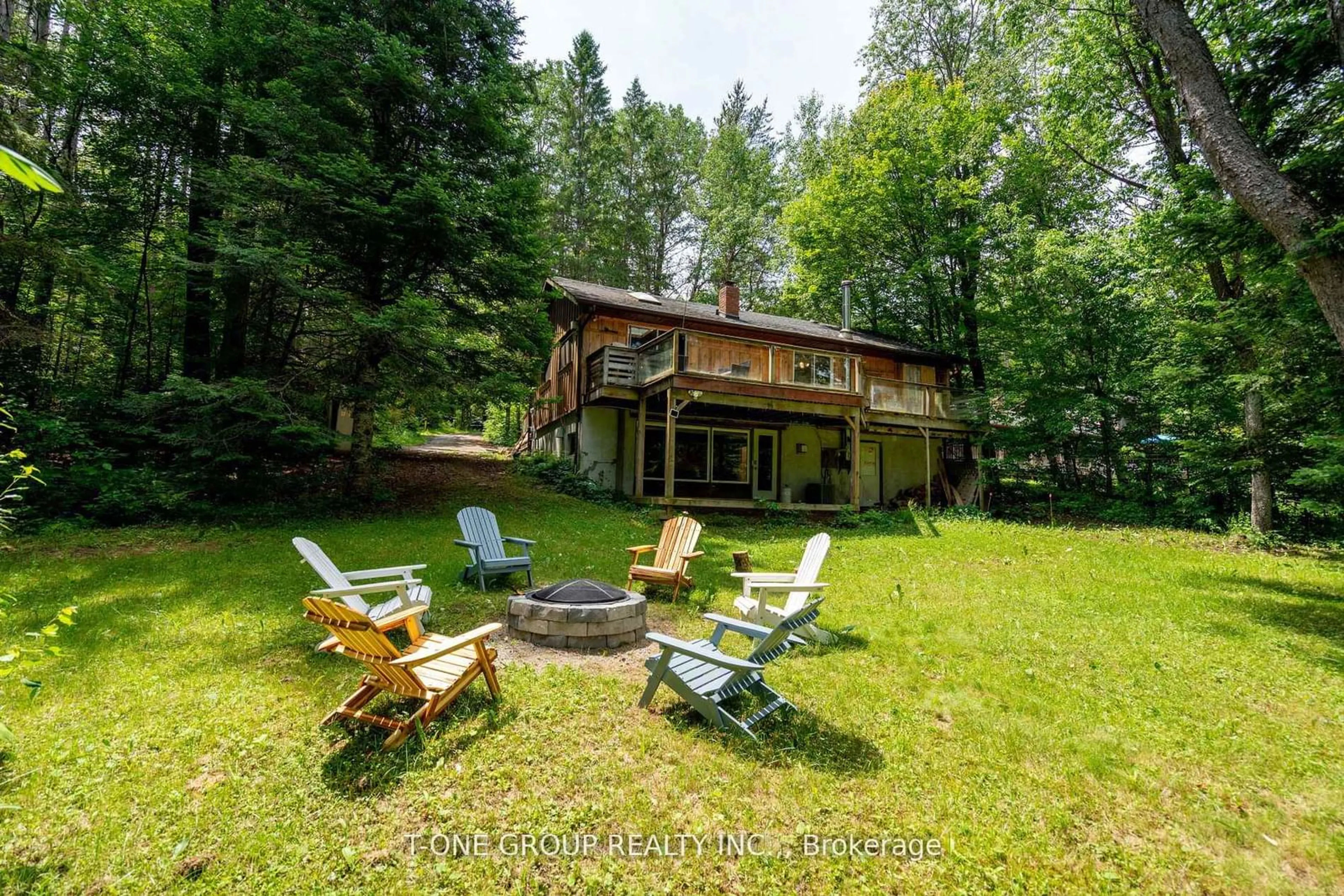 A pic from outside/outdoor area/front of a property/back of a property/a pic from drone, forest/trees view for 10 Riverside Crct, Hastings Highlands Ontario K0L 1C0