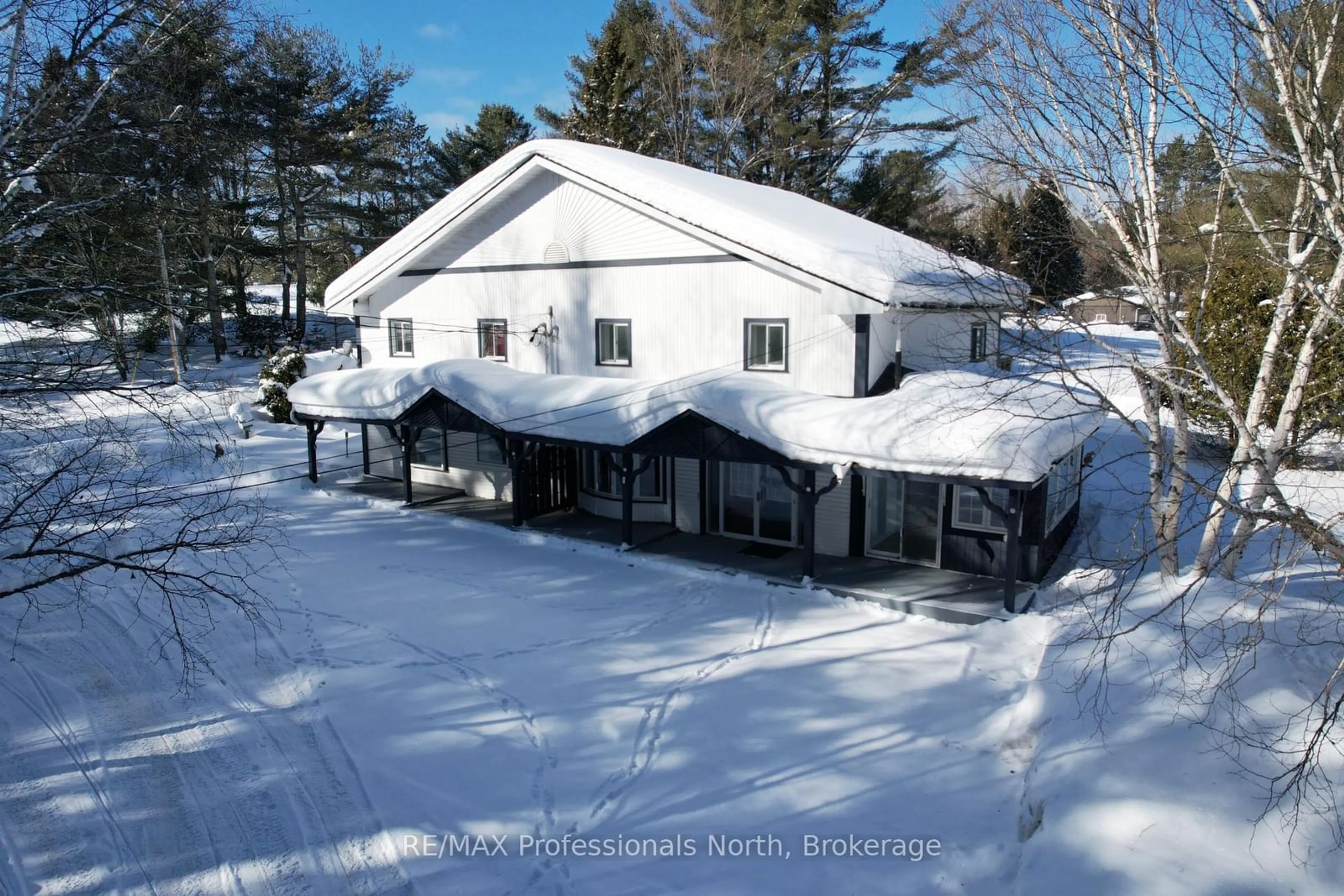 A pic from outside/outdoor area/front of a property/back of a property/a pic from drone, building for 310 Muskoka Rd 10 Rd, Huntsville Ontario P0B 1L0