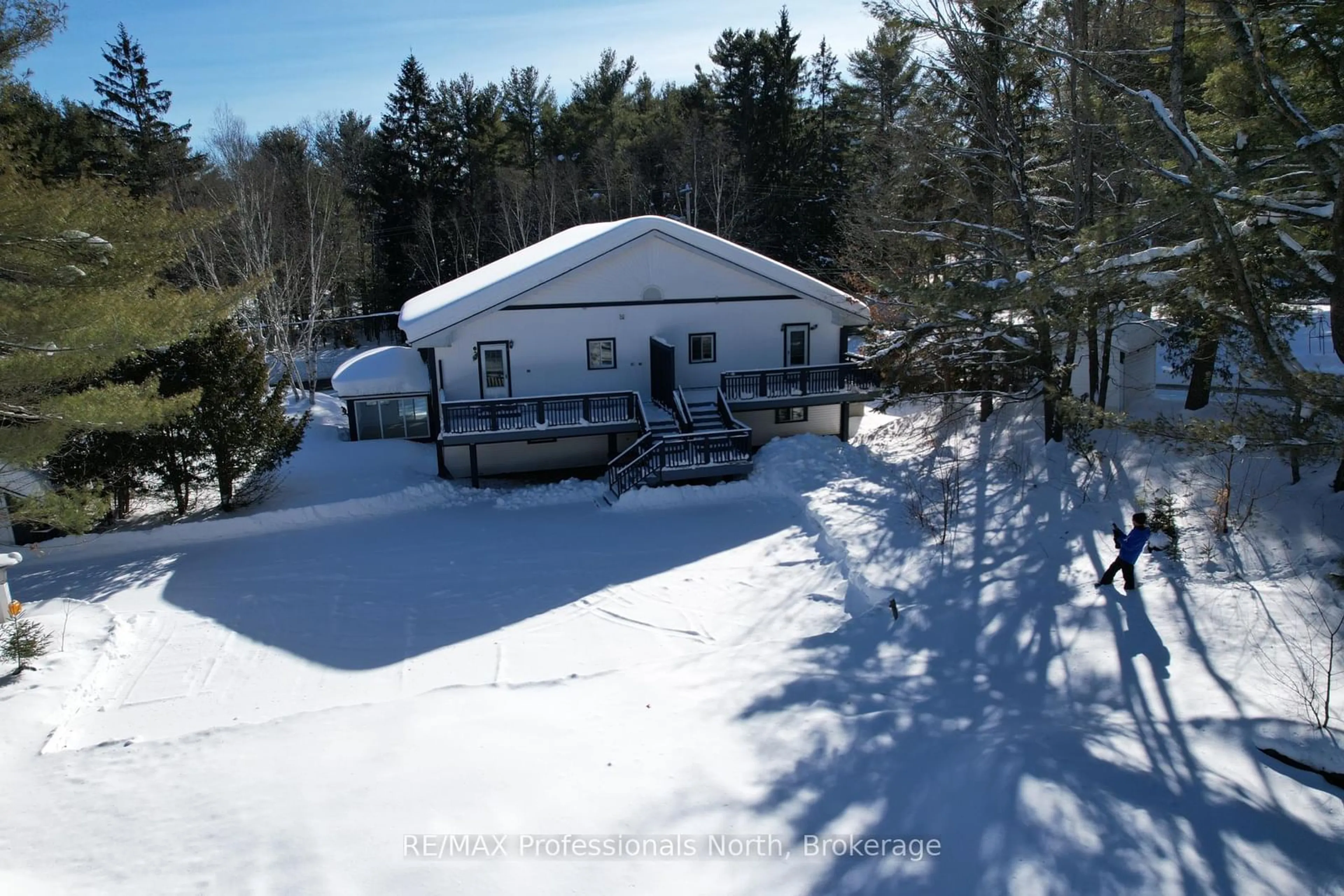 A pic from outside/outdoor area/front of a property/back of a property/a pic from drone, unknown for 310 Muskoka Rd 10 Rd, Huntsville Ontario P0B 1L0