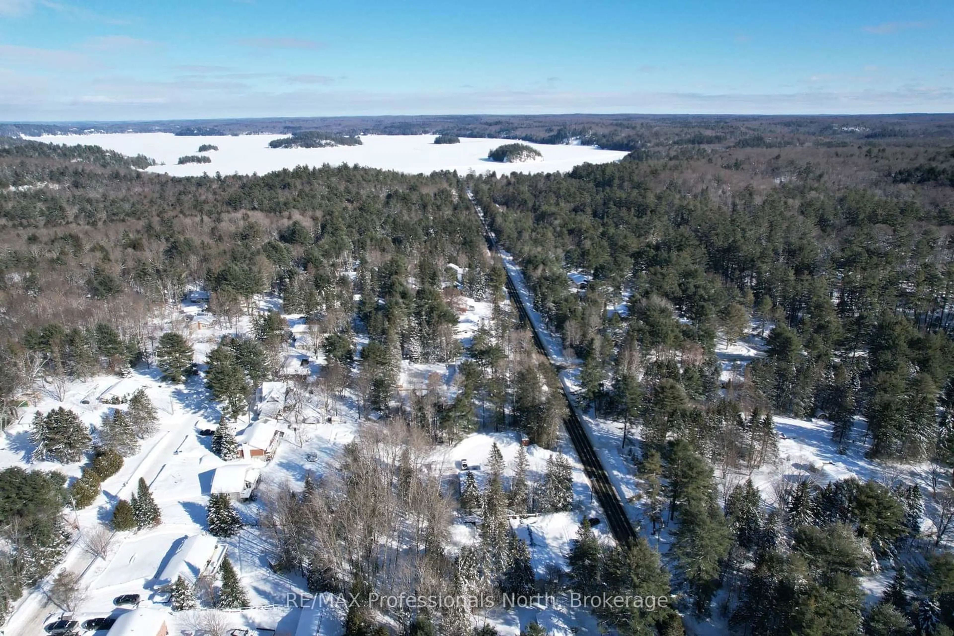 A pic from outside/outdoor area/front of a property/back of a property/a pic from drone, forest/trees view for 310 Muskoka Rd 10 Rd, Huntsville Ontario P0B 1L0