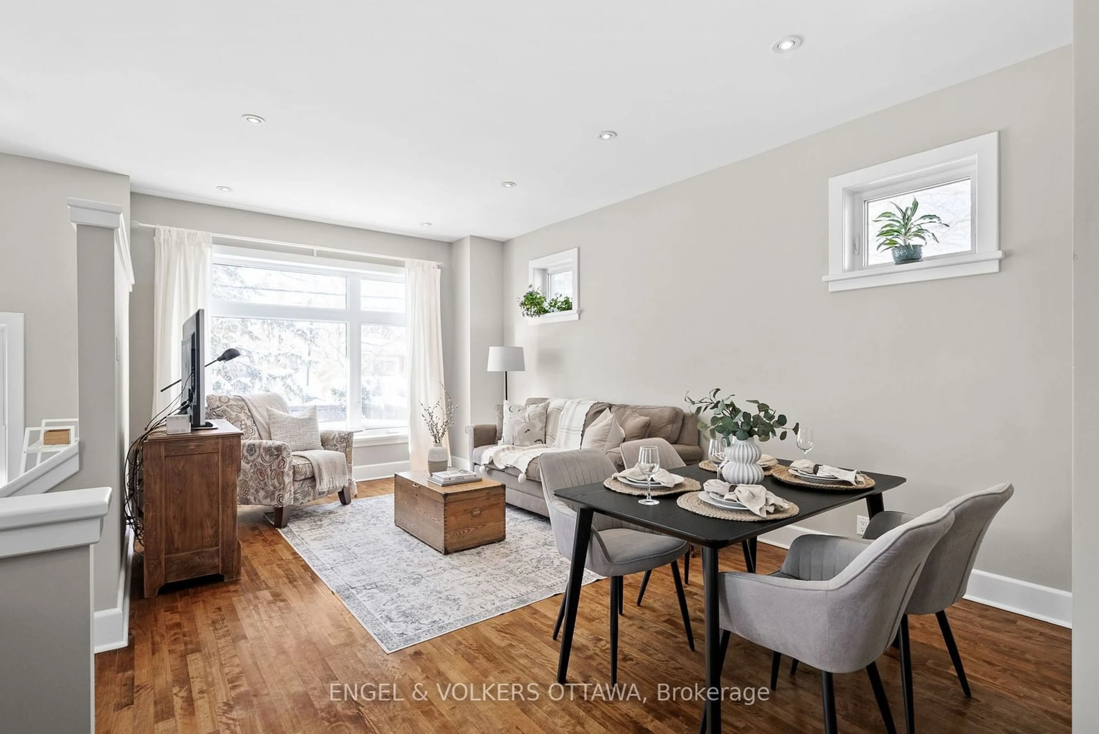 Living room with furniture, wood/laminate floor for 100 Grange Ave, Tunneys Pasture and Ottawa West Ontario K1Y 0N9