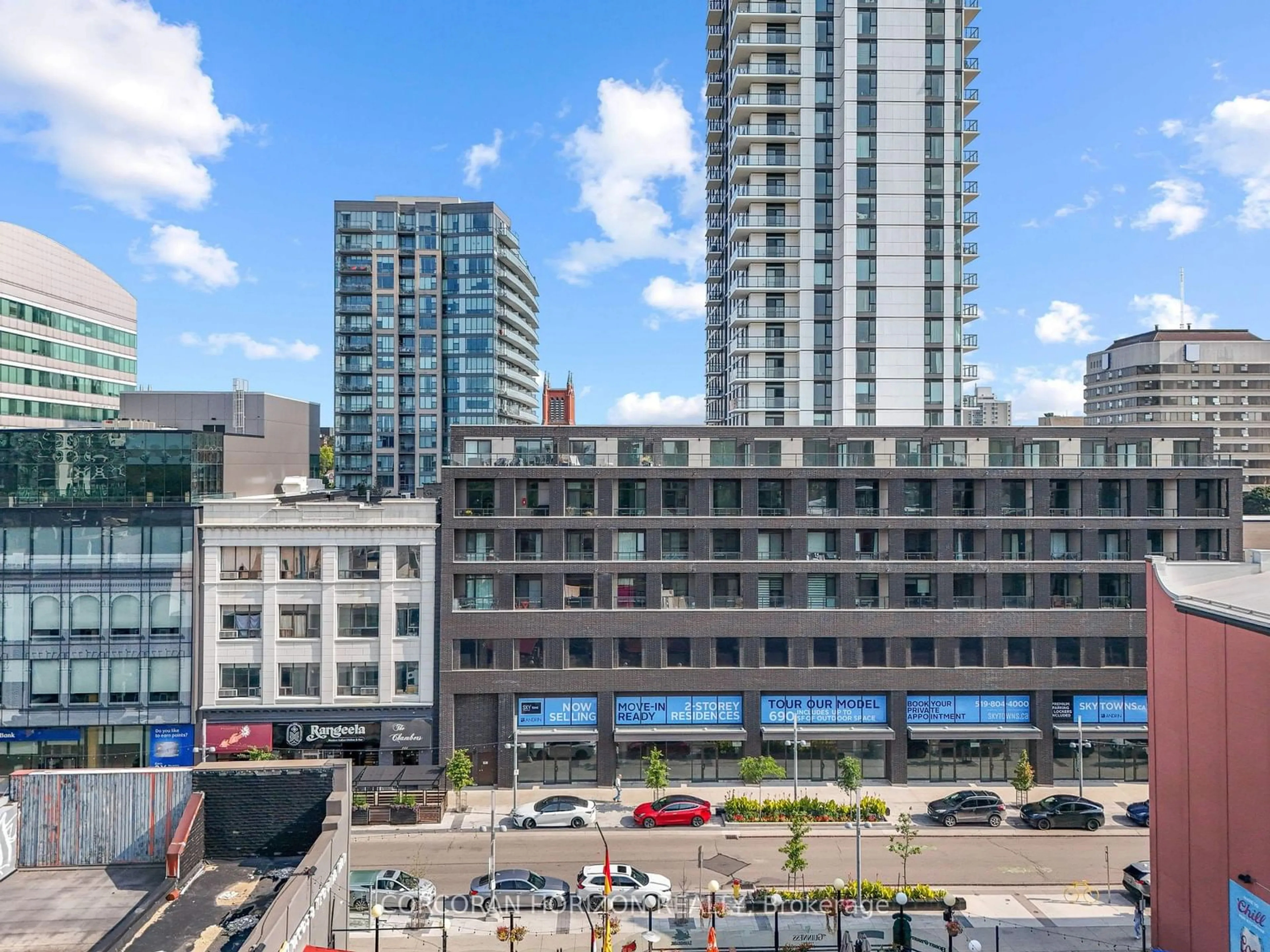 Patio, city buildings view from balcony for 55 Duke St #509, Kitchener Ontario N2H 0C9