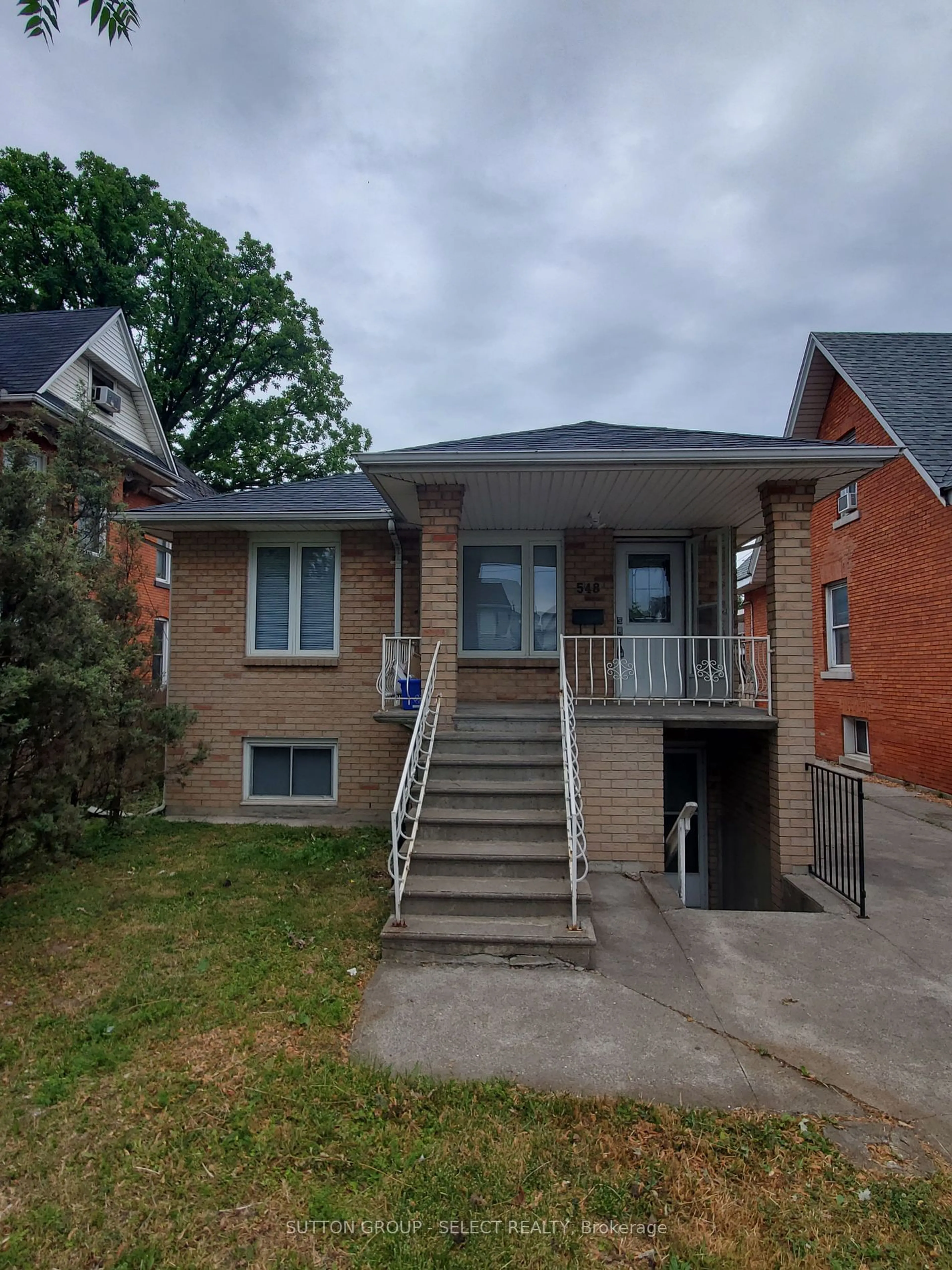 Home with brick exterior material, street for 548 Caron Ave, Windsor Ontario N9A 5B4