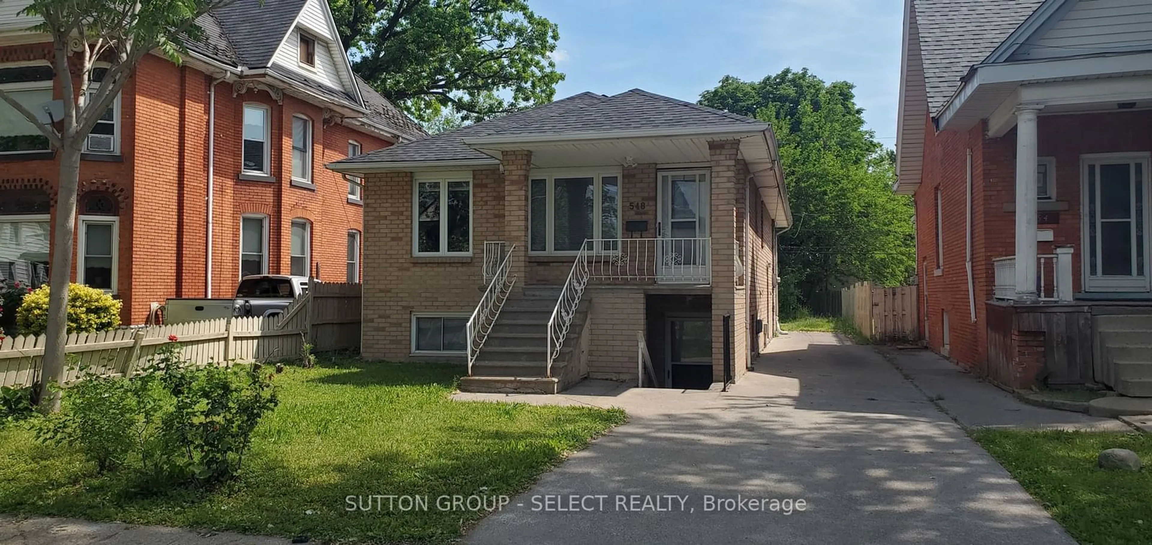 Home with brick exterior material, street for 548 Caron Ave, Windsor Ontario N9A 5B4