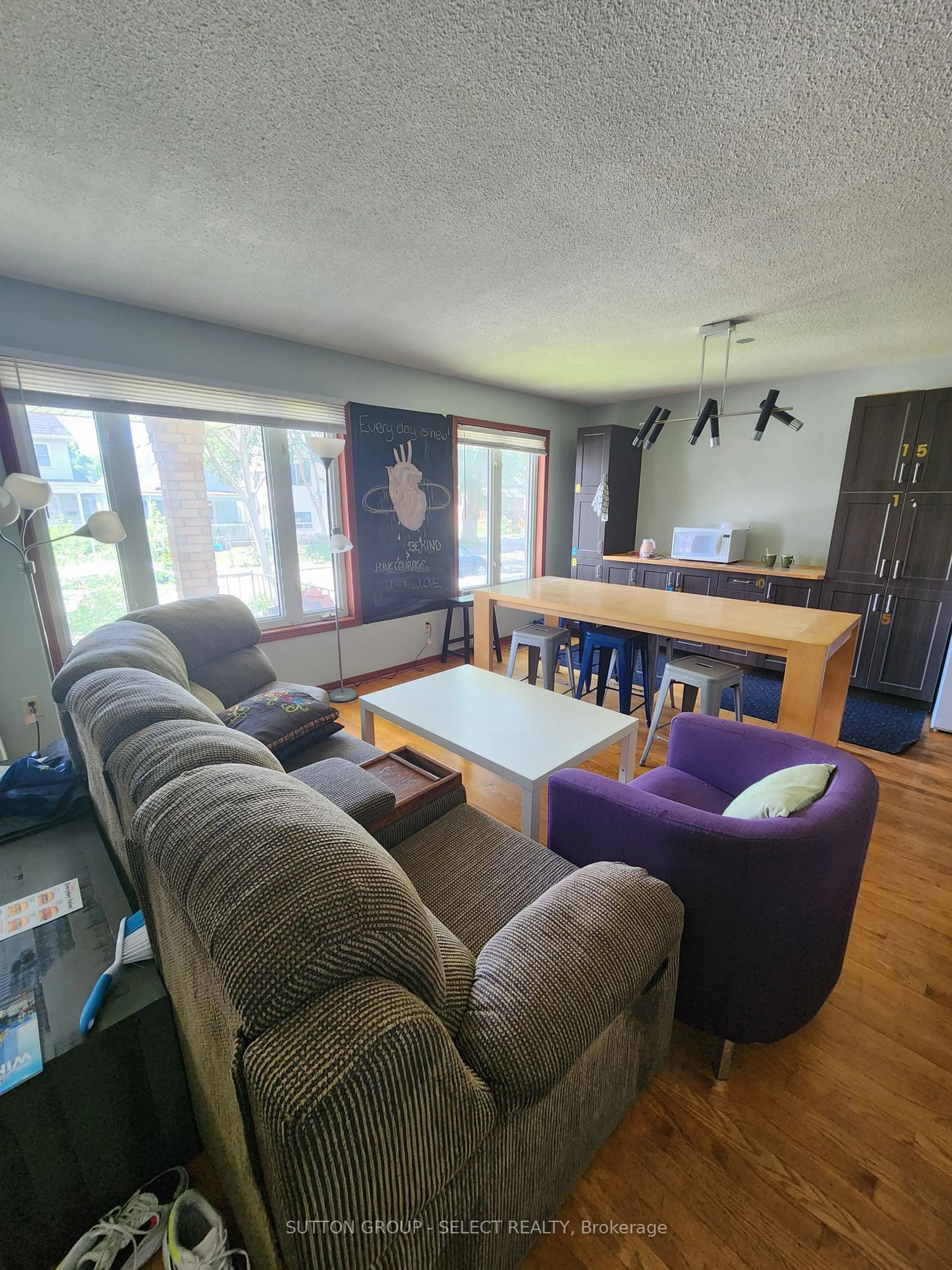 Living room with furniture, wood/laminate floor for 548 Caron Ave, Windsor Ontario N9A 5B4