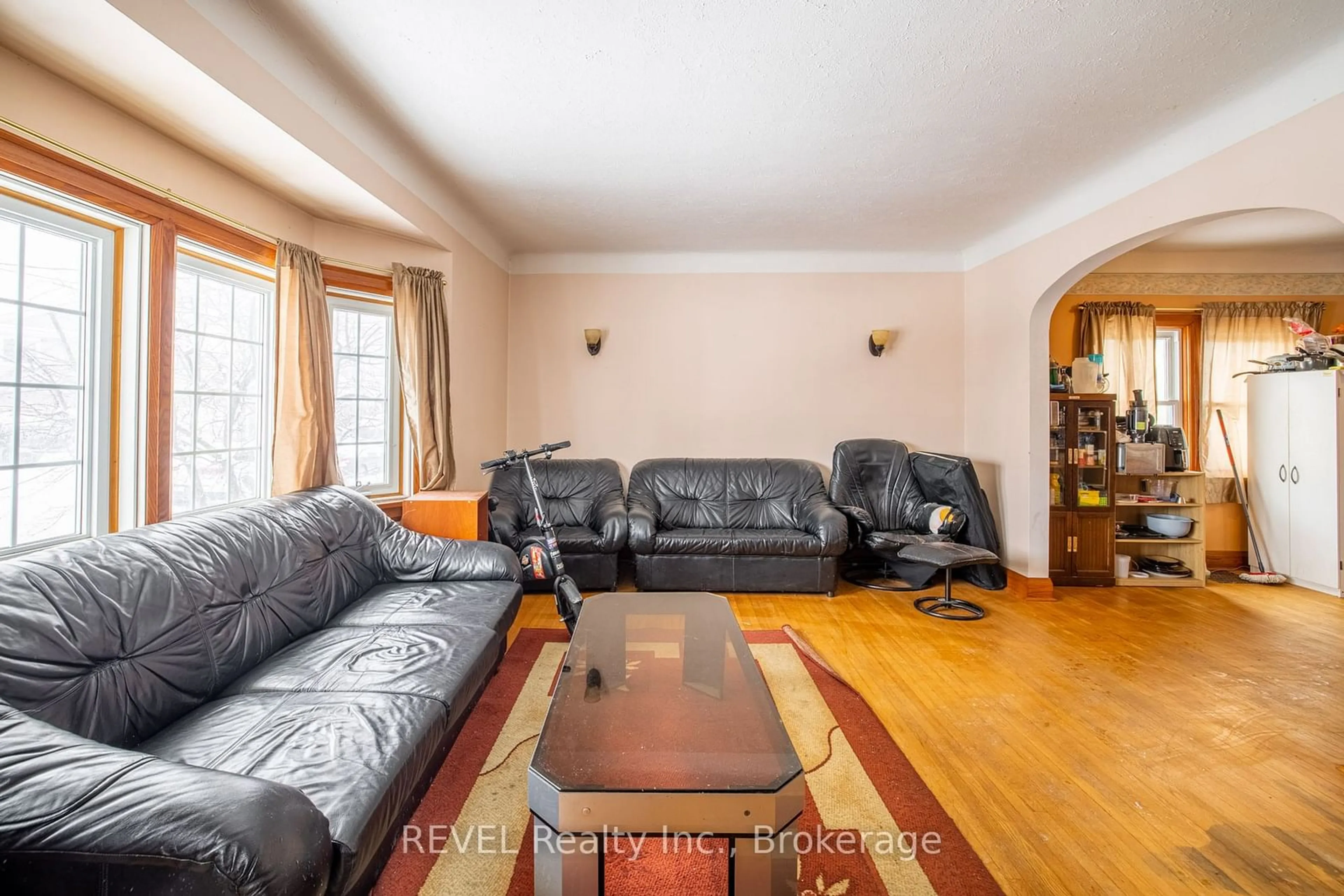 Living room with furniture, wood/laminate floor for 52 Leeper St, St. Catharines Ontario L2S 2N2