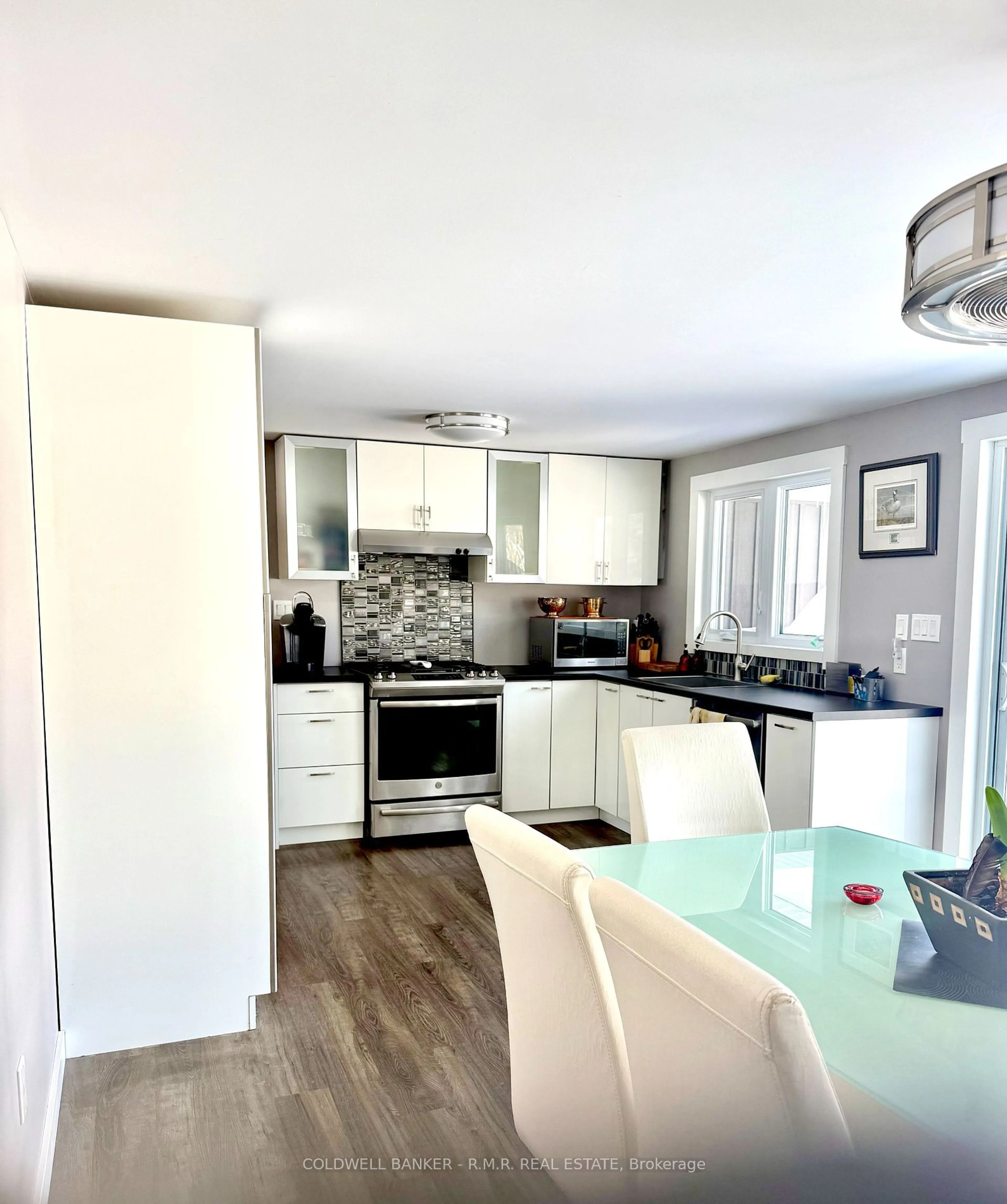 Open concept kitchen, wood/laminate floor for 38 Maple Grove Rd, Kawartha Lakes Ontario K9V 4R6