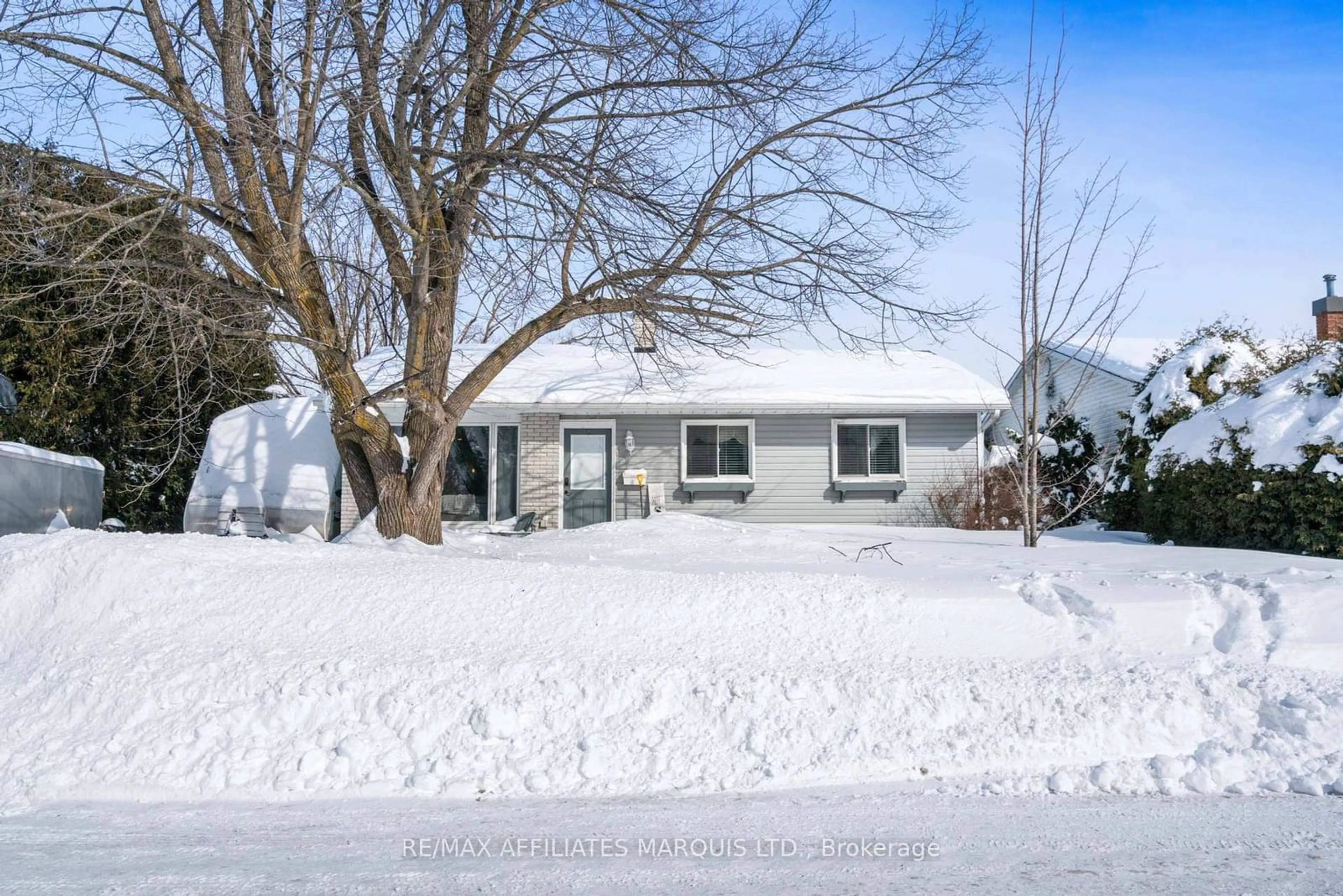 Home with vinyl exterior material, street for 58 Courtney Rd, Kanata Ontario K2L 1L8