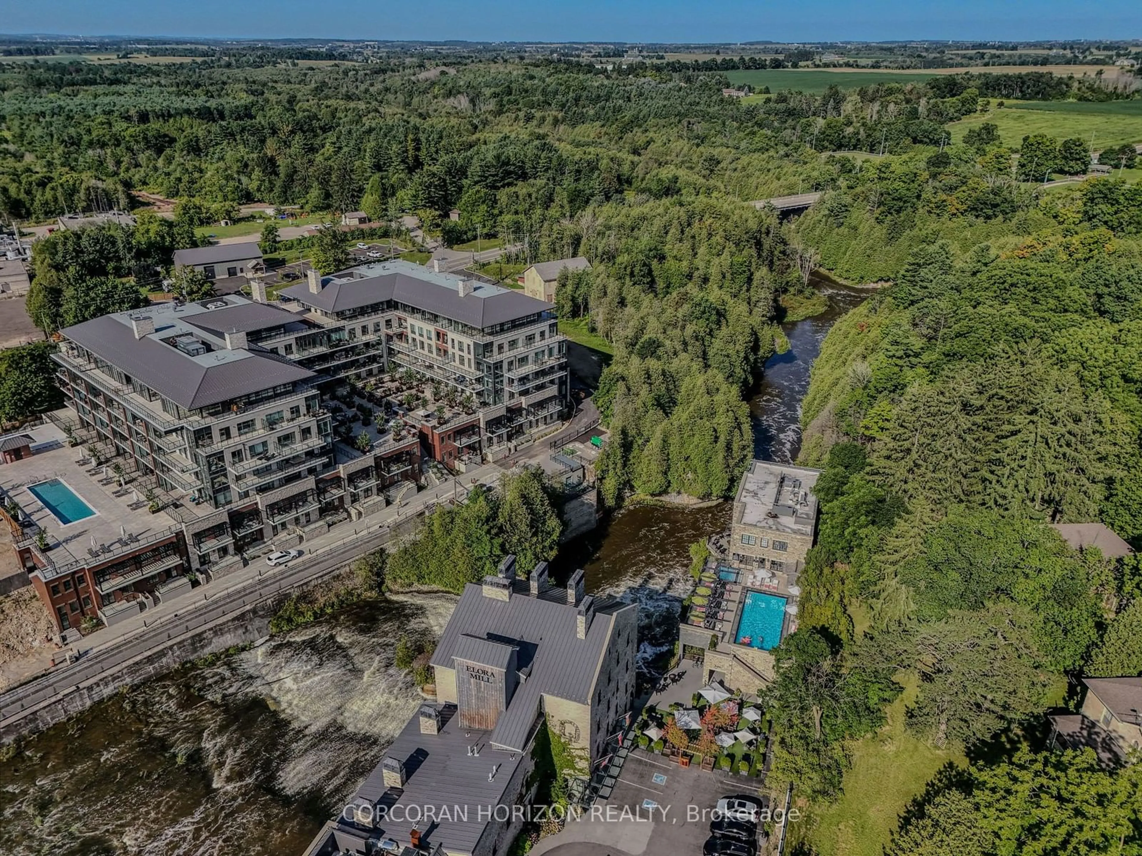 A pic from outside/outdoor area/front of a property/back of a property/a pic from drone, city buildings view from balcony for 6523 Wellington 7 Rd #203, Centre Wellington Ontario N0B 1S0