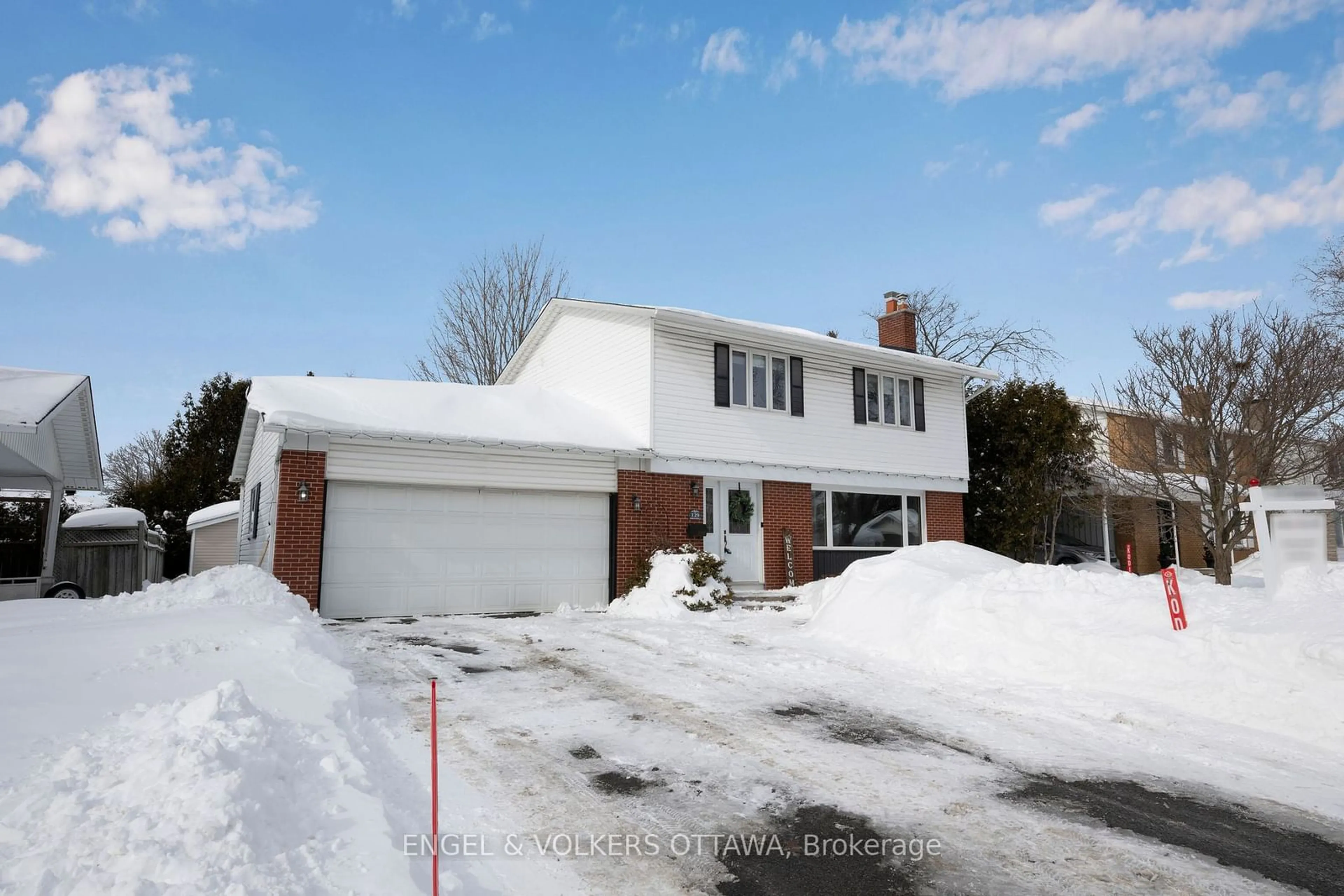 Home with brick exterior material, street for 129 Abbeyhill Dr, Kanata Ontario K2L 1H4