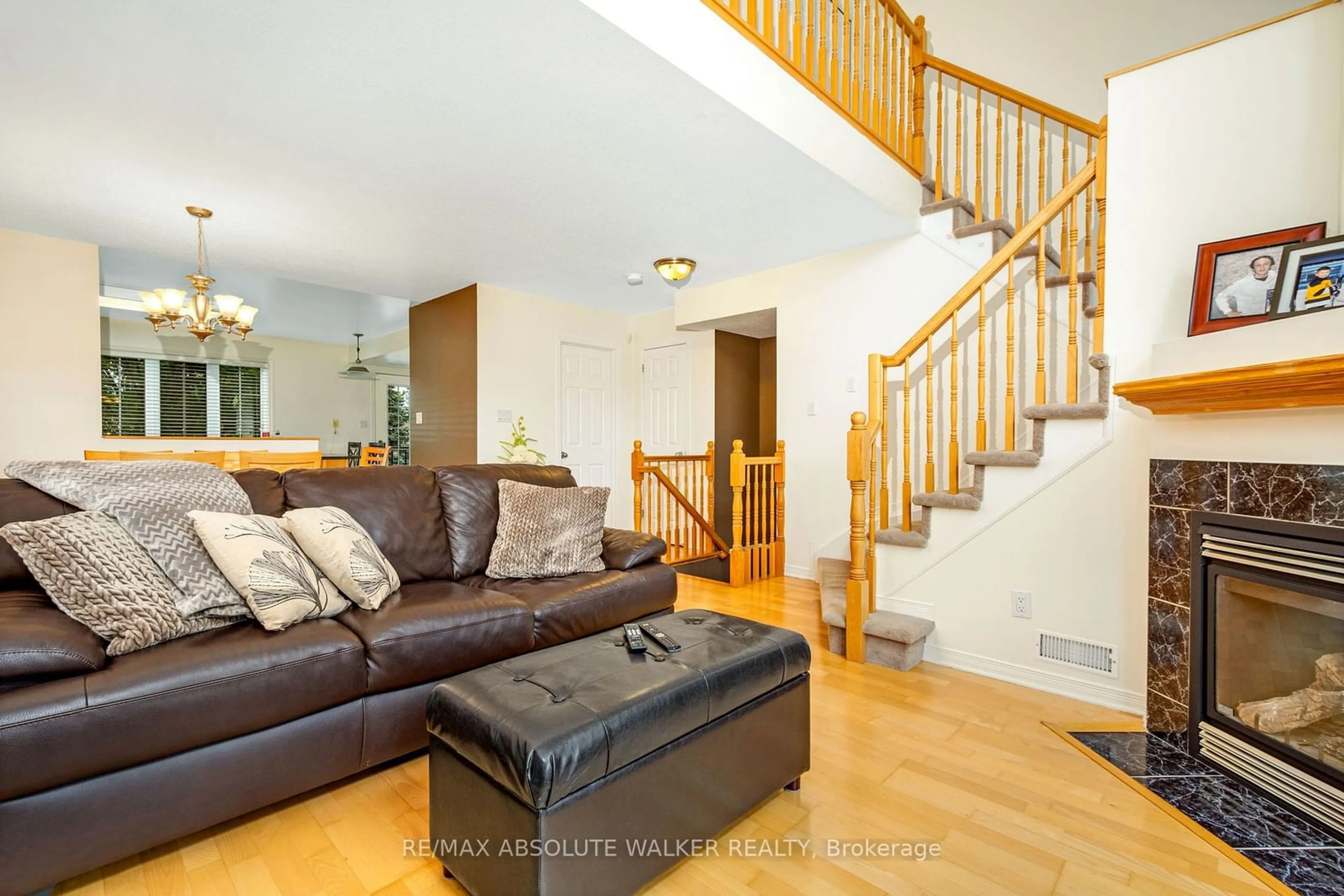 Living room with furniture, wood/laminate floor for 107 Gatestone Private #7, Beacon Hill North - South and Area Ontario K1J 1K5