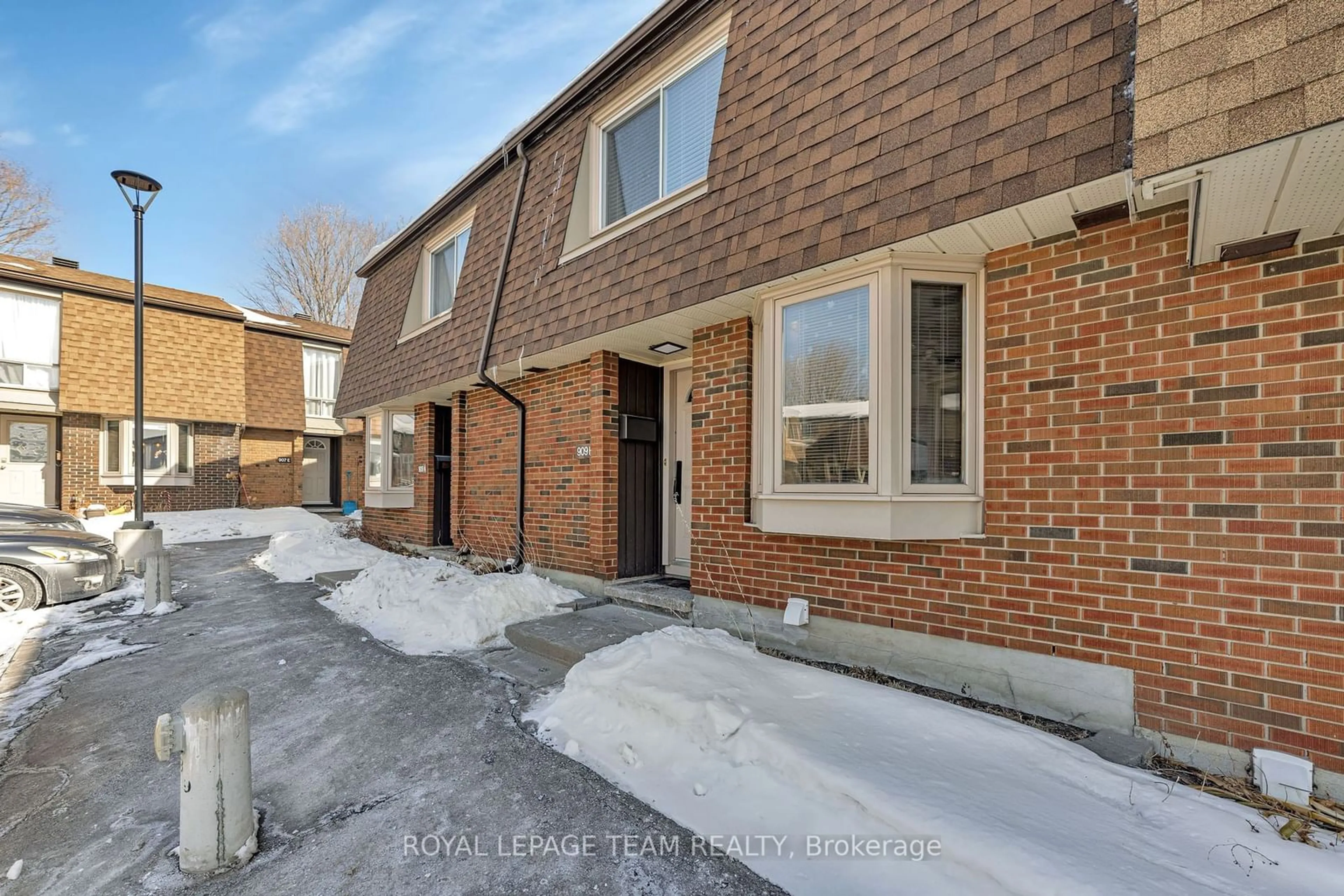 Home with brick exterior material, street for 909 Elmsmere Rd #B, Ottawa Ontario K1J 8G4