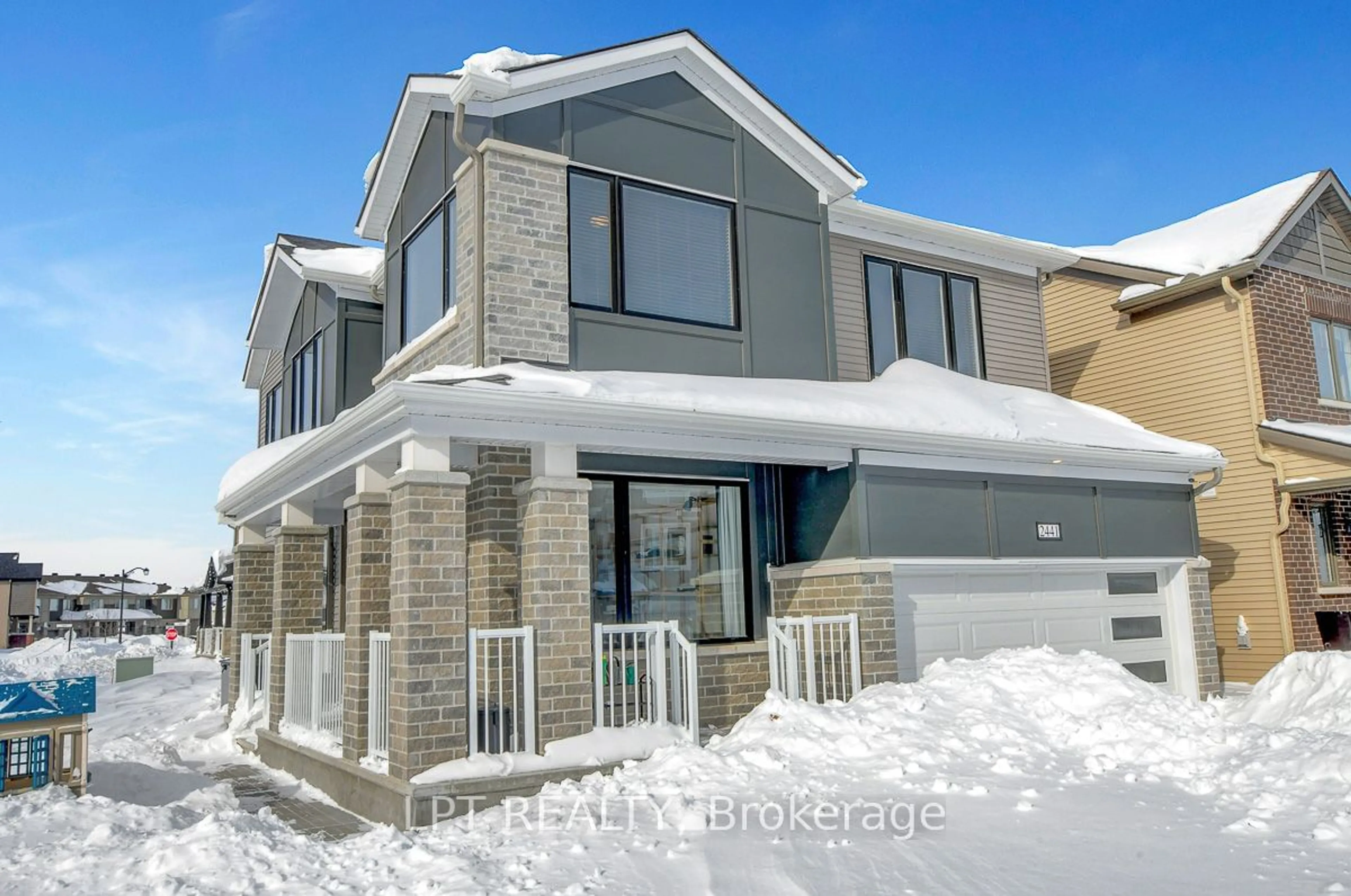 Home with brick exterior material, street for 2441 Watercolours Way, Barrhaven Ontario K2J 6N8